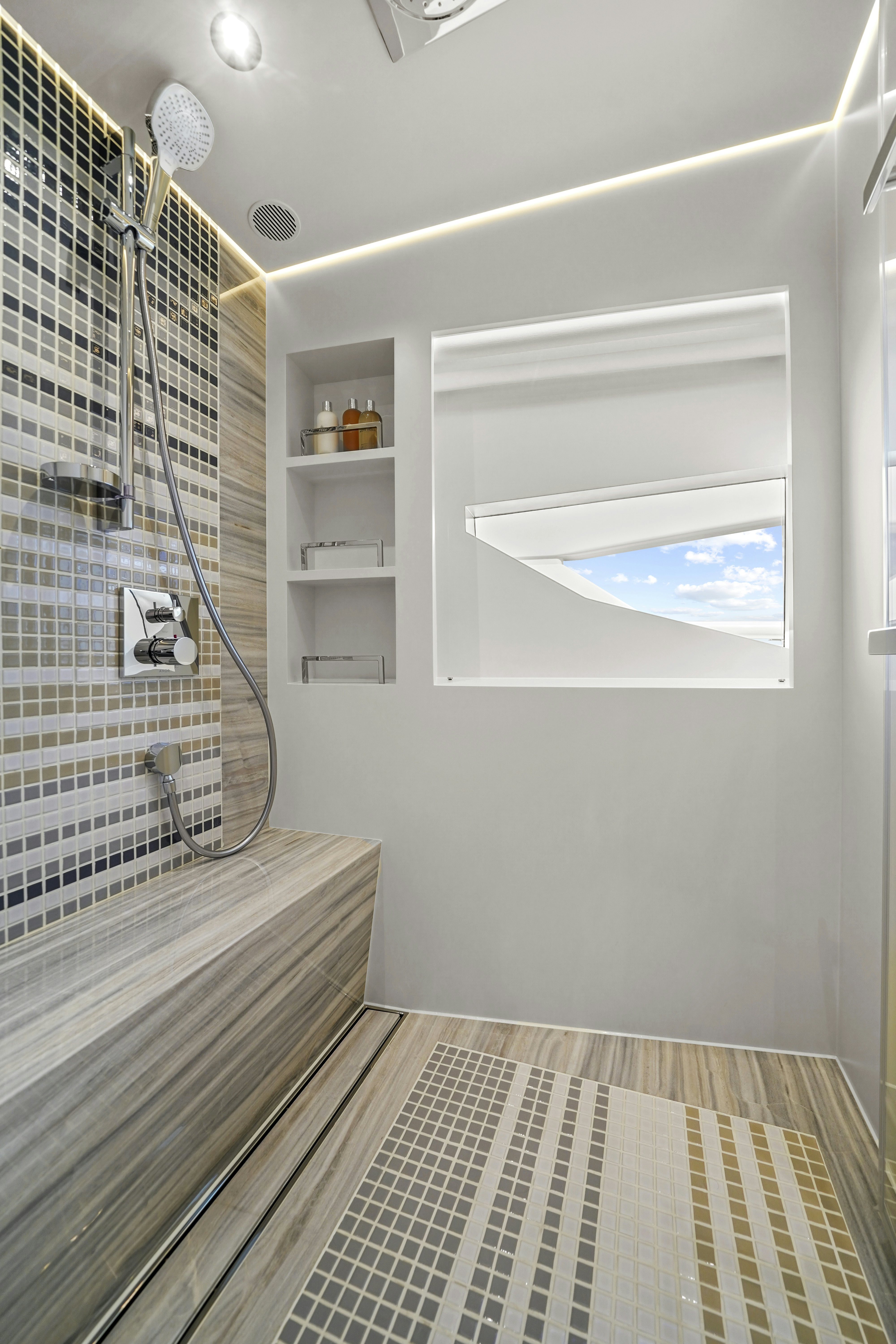 a bathroom with a shower aboard MISS MICHELLE Yacht for Sale