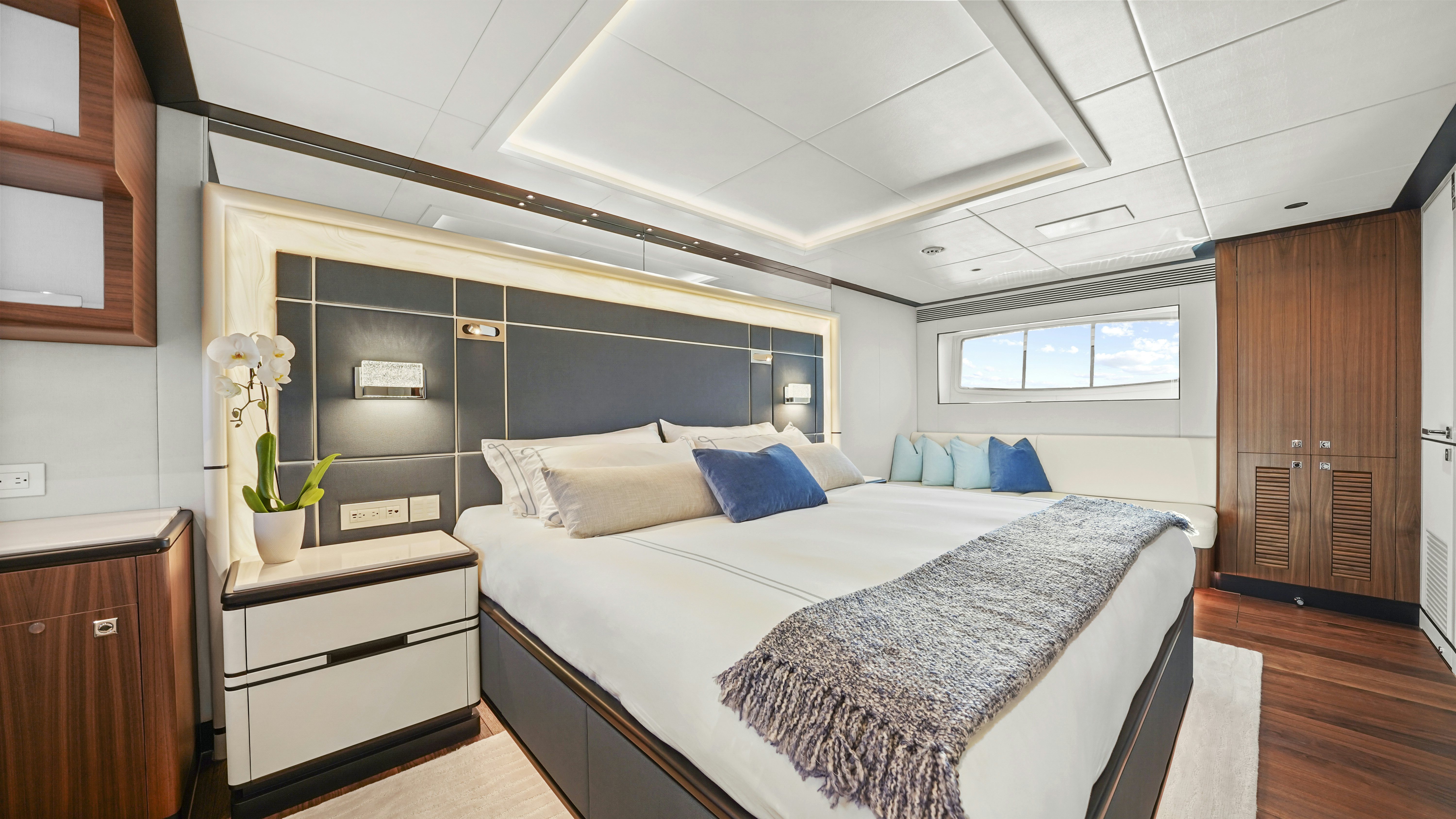 a bedroom with a bed and a desk aboard MISS MICHELLE Yacht for Sale