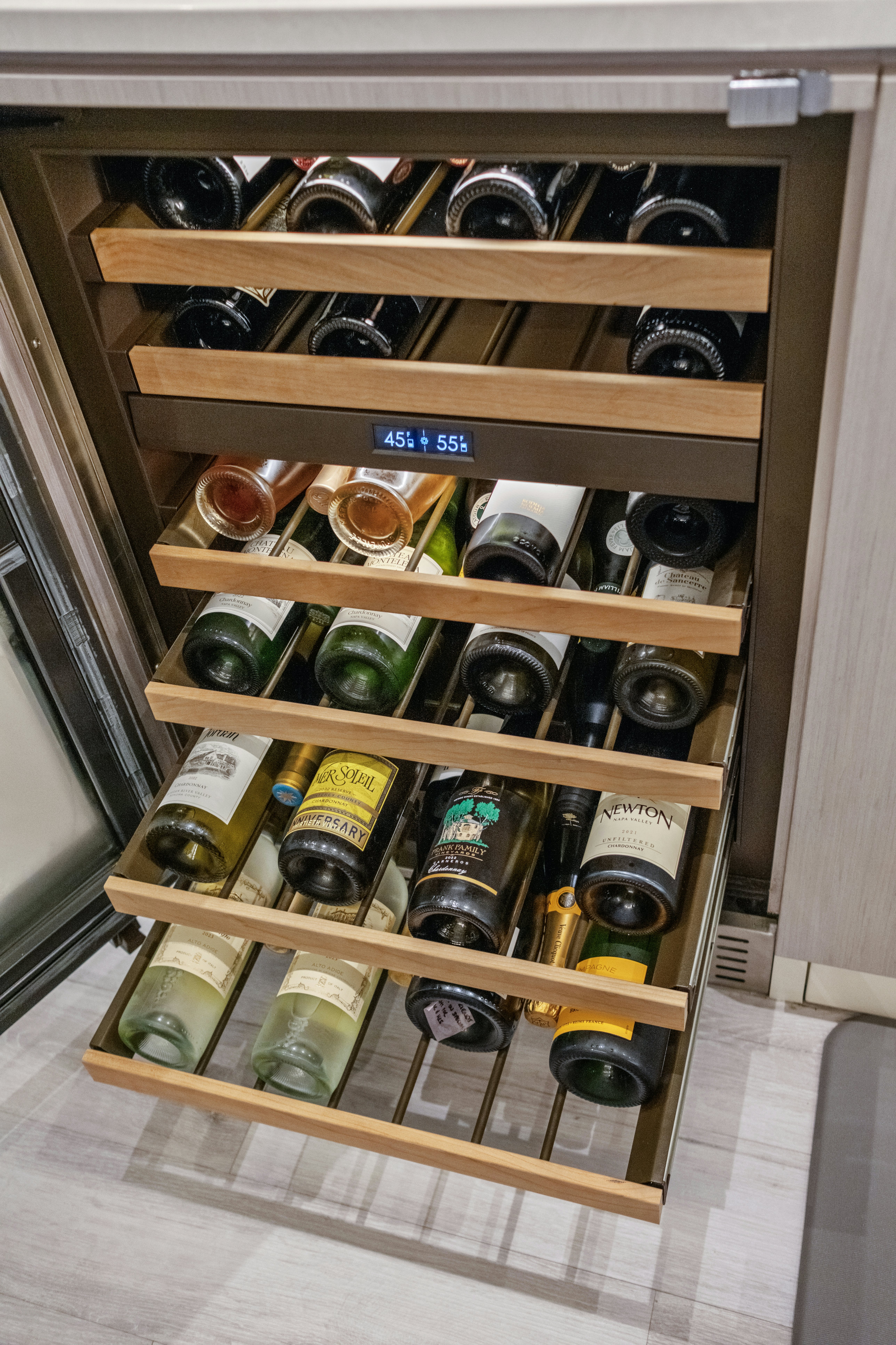 a shelf with bottles and cans aboard MISS MICHELLE Yacht for Sale