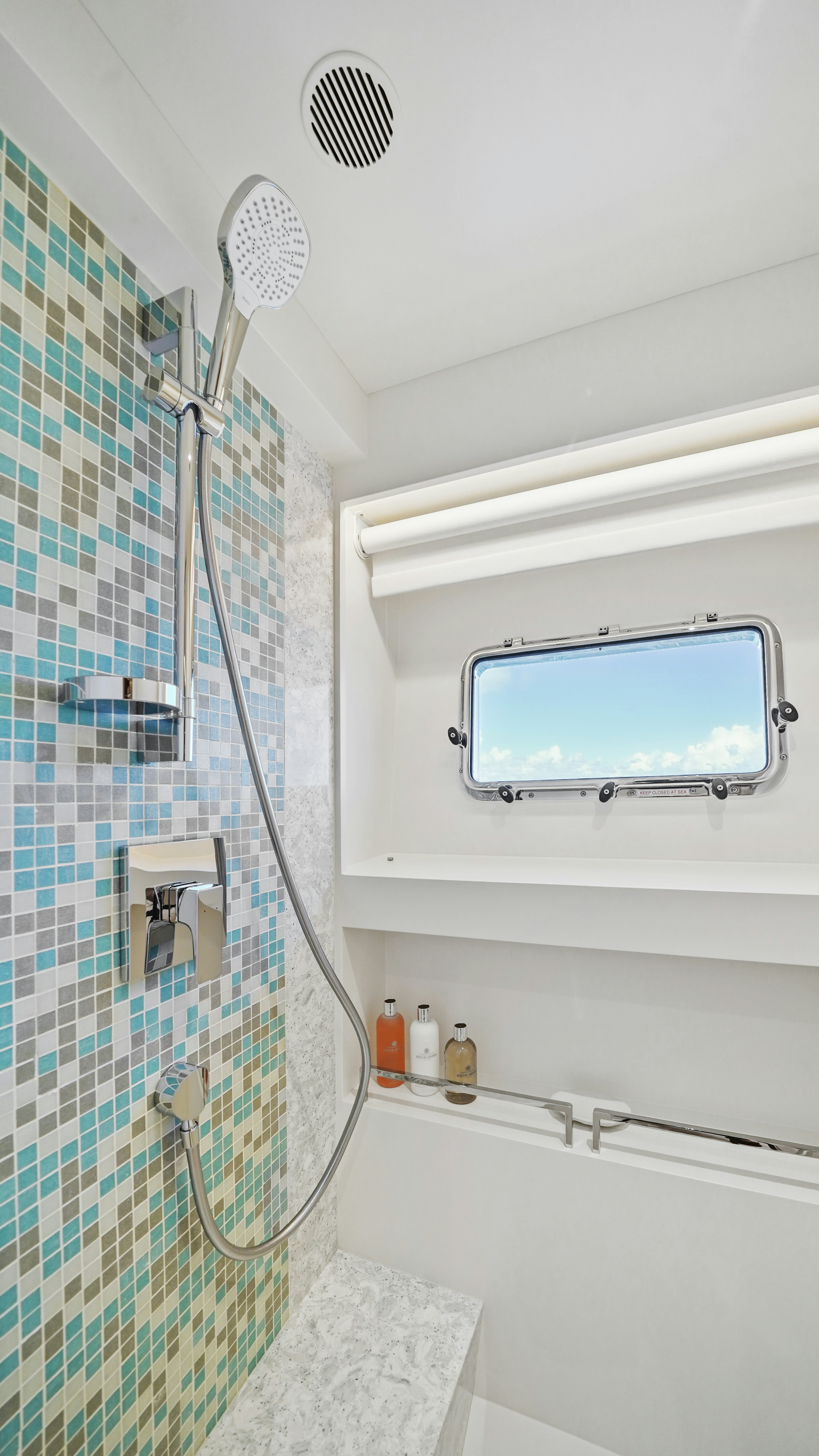 a shower with a glass wall aboard MISS MICHELLE Yacht for Sale