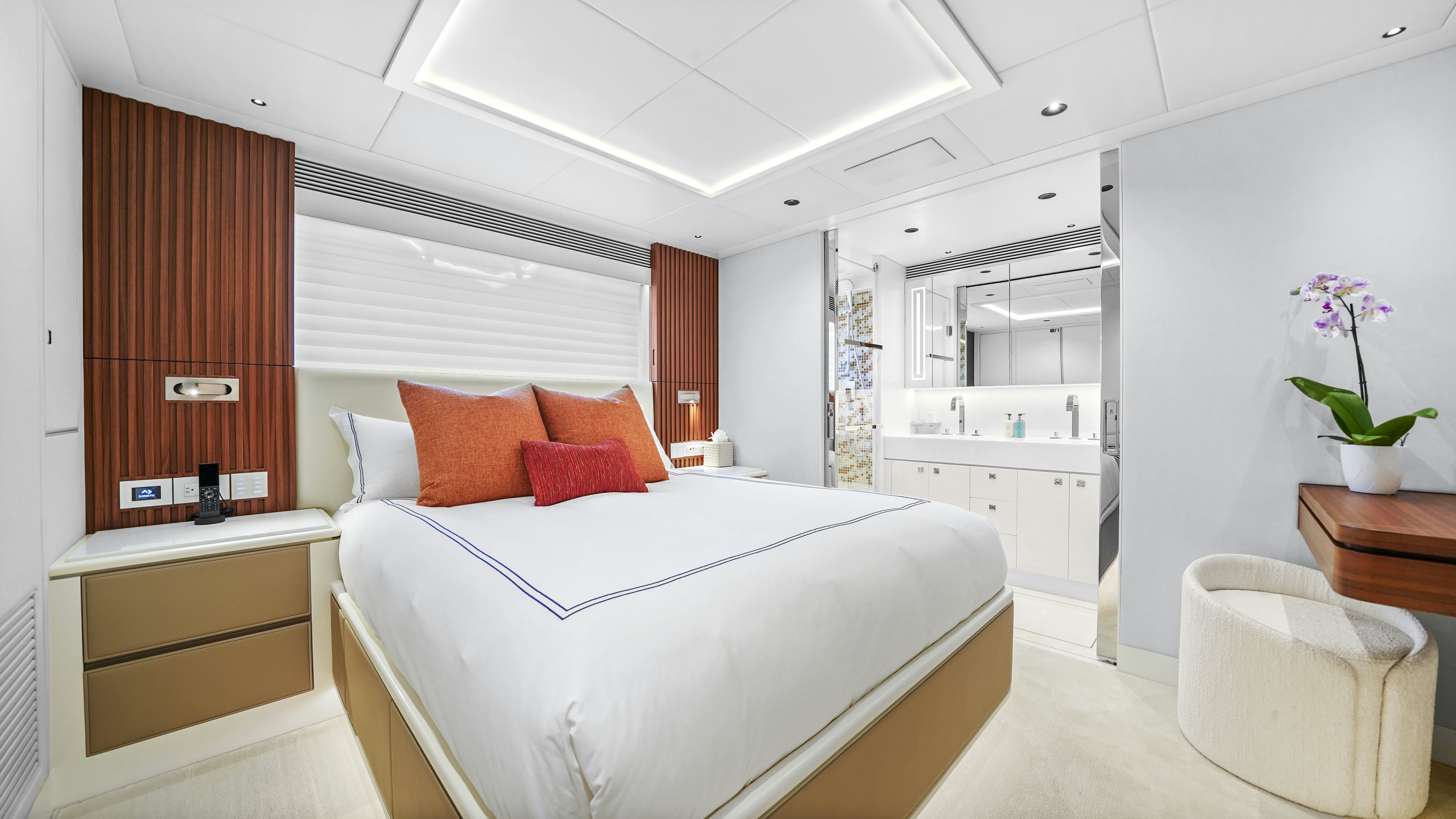 a bedroom with a bed and a desk aboard MISS MICHELLE Yacht for Sale