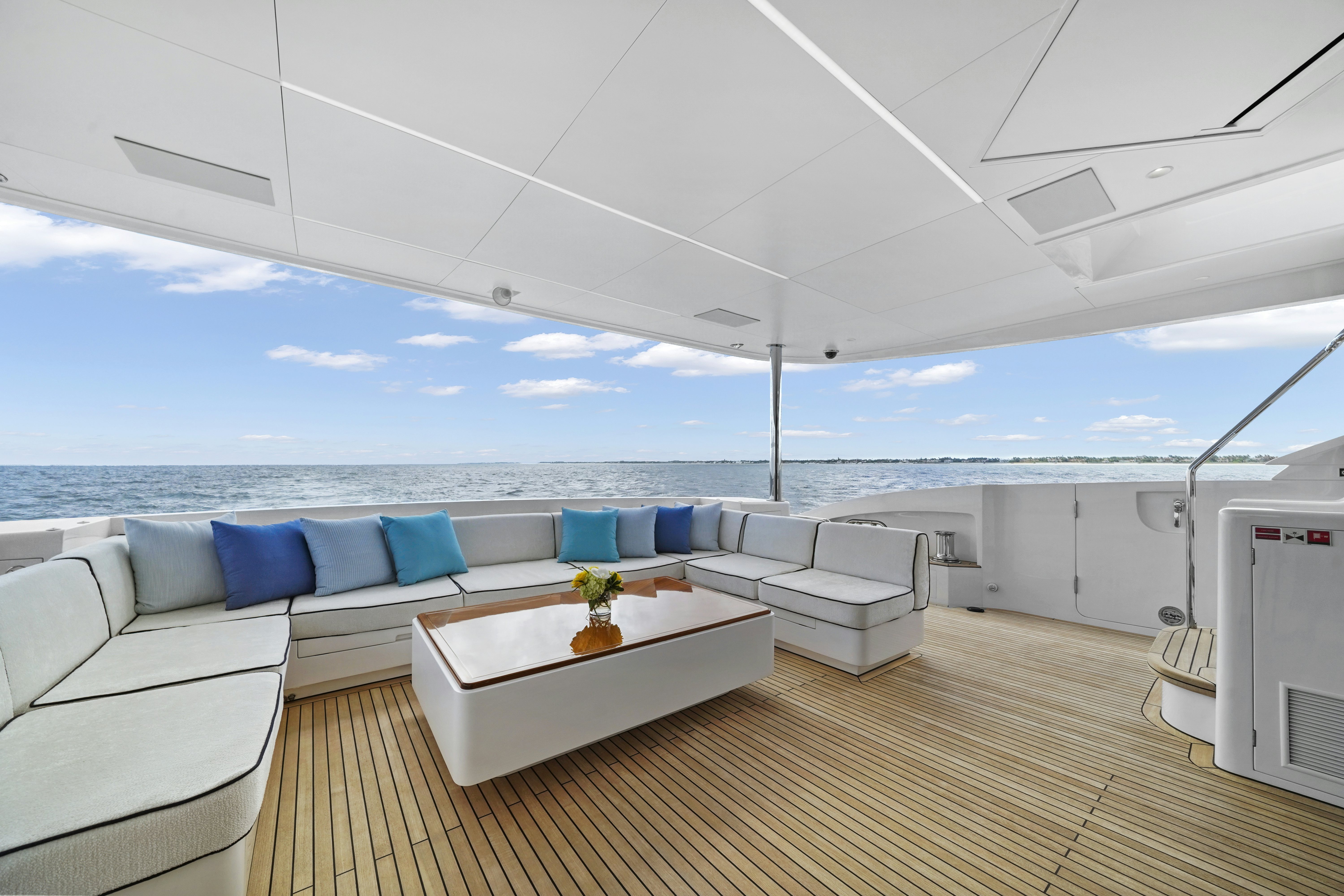 a room with a couch and a table and a chair aboard MISS MICHELLE Yacht for Sale
