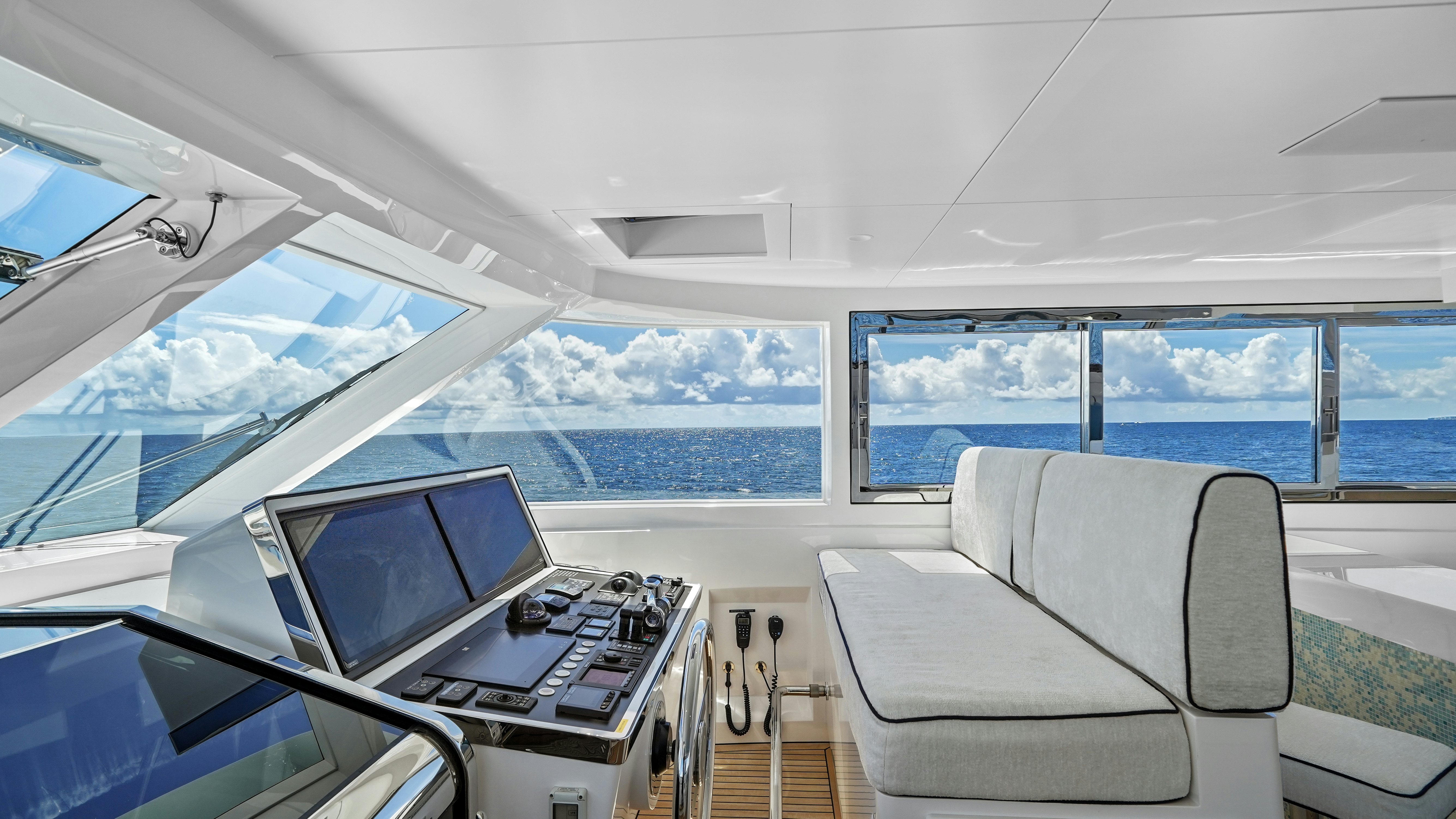 inside of a boat with a laptop and a laptop on a table aboard MISS MICHELLE Yacht for Sale