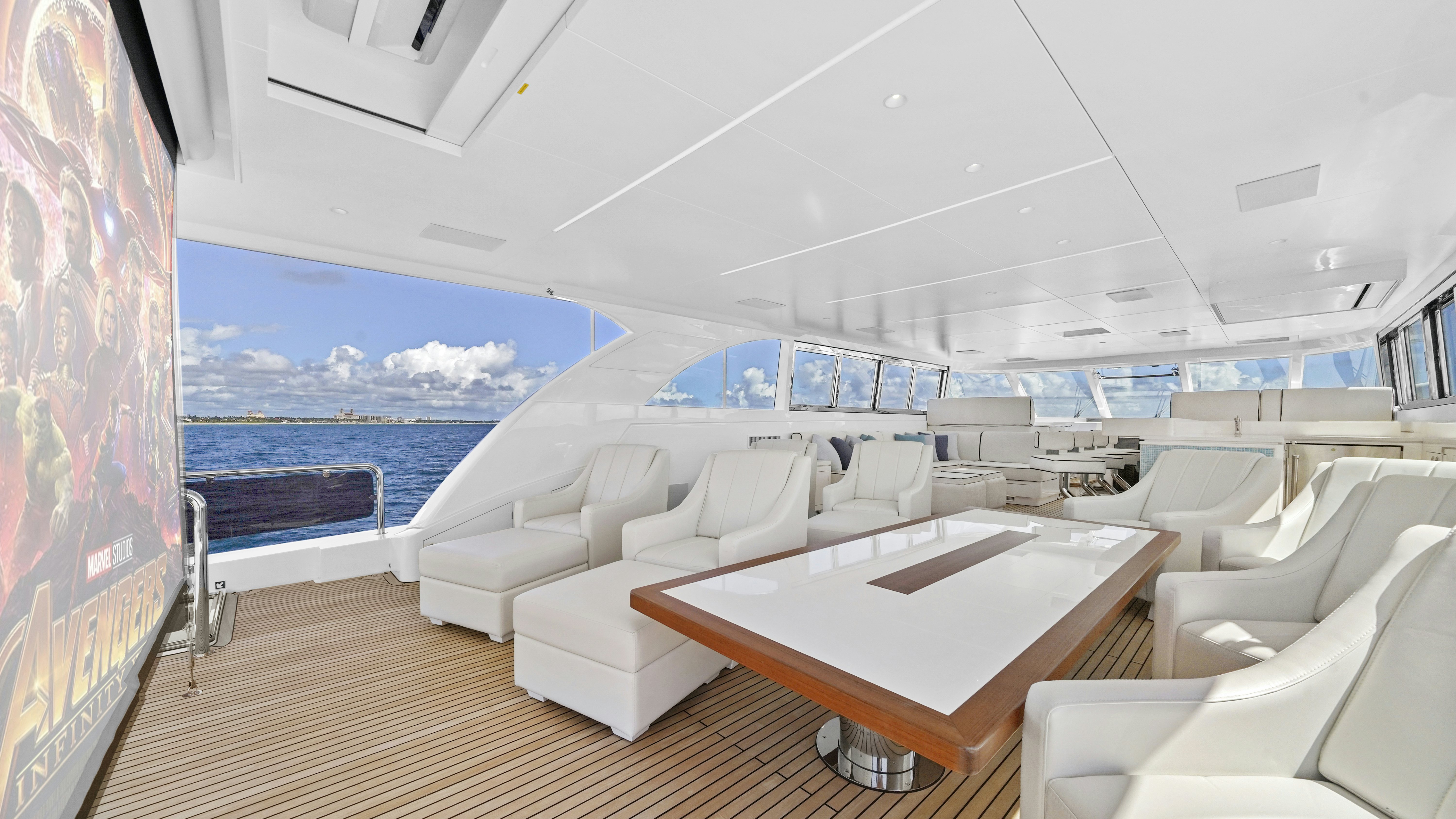 a room with a table and chairs aboard MISS MICHELLE Yacht for Sale