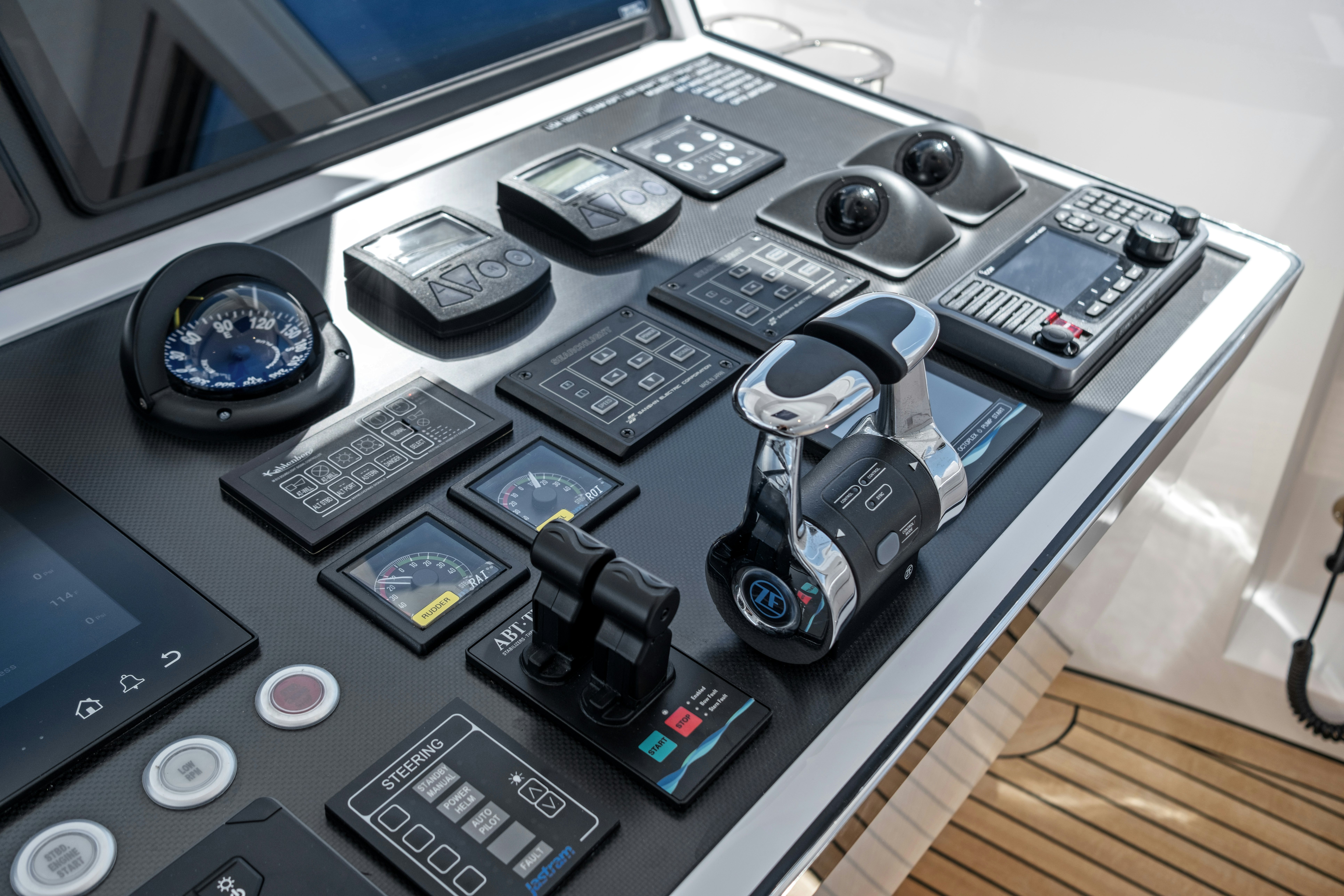 a desk with a laptop and electronics aboard MISS MICHELLE Yacht for Sale