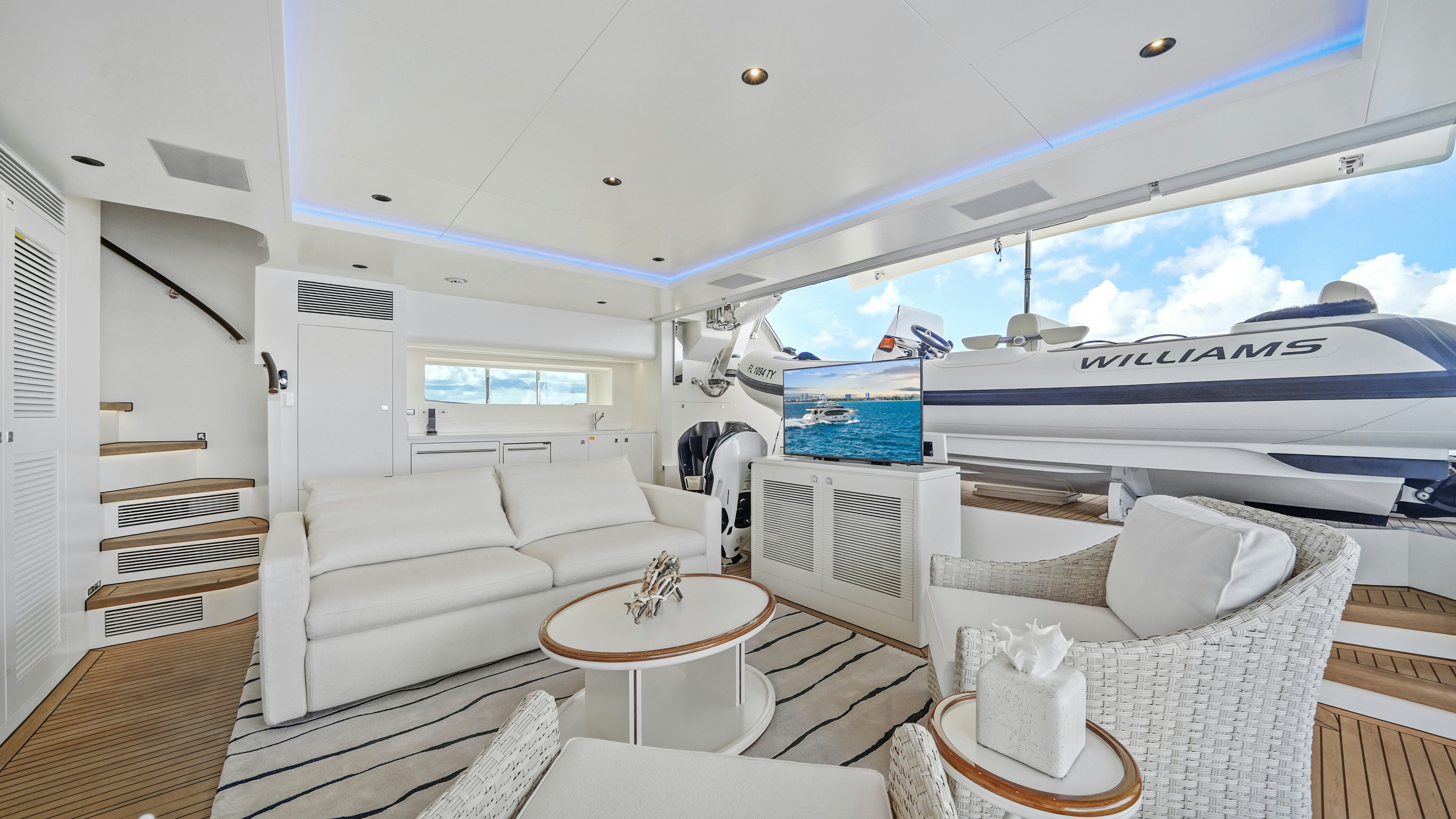 a living room with a large window aboard MISS MICHELLE Yacht for Sale