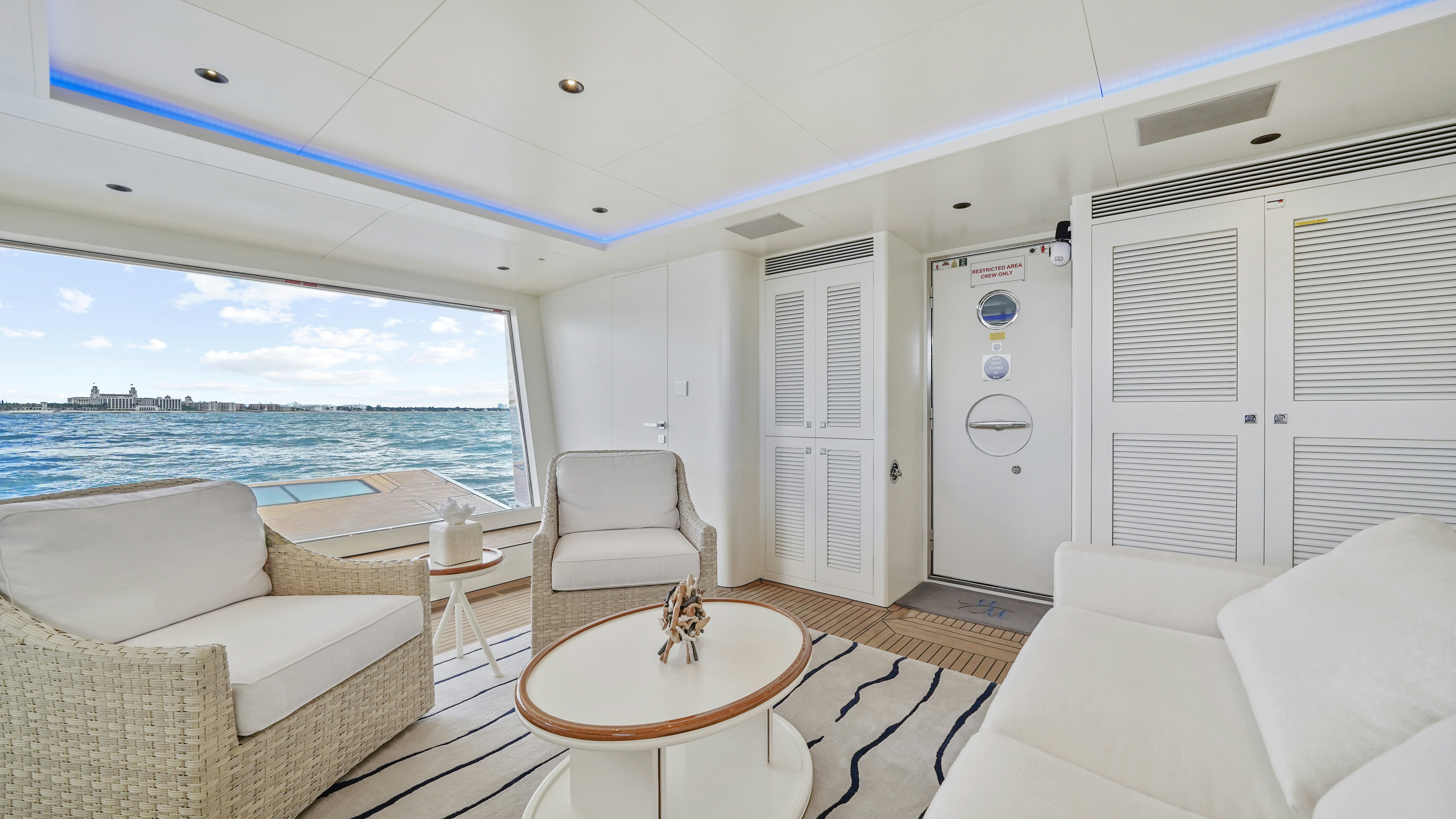 a living room with a large window aboard MISS MICHELLE Yacht for Sale