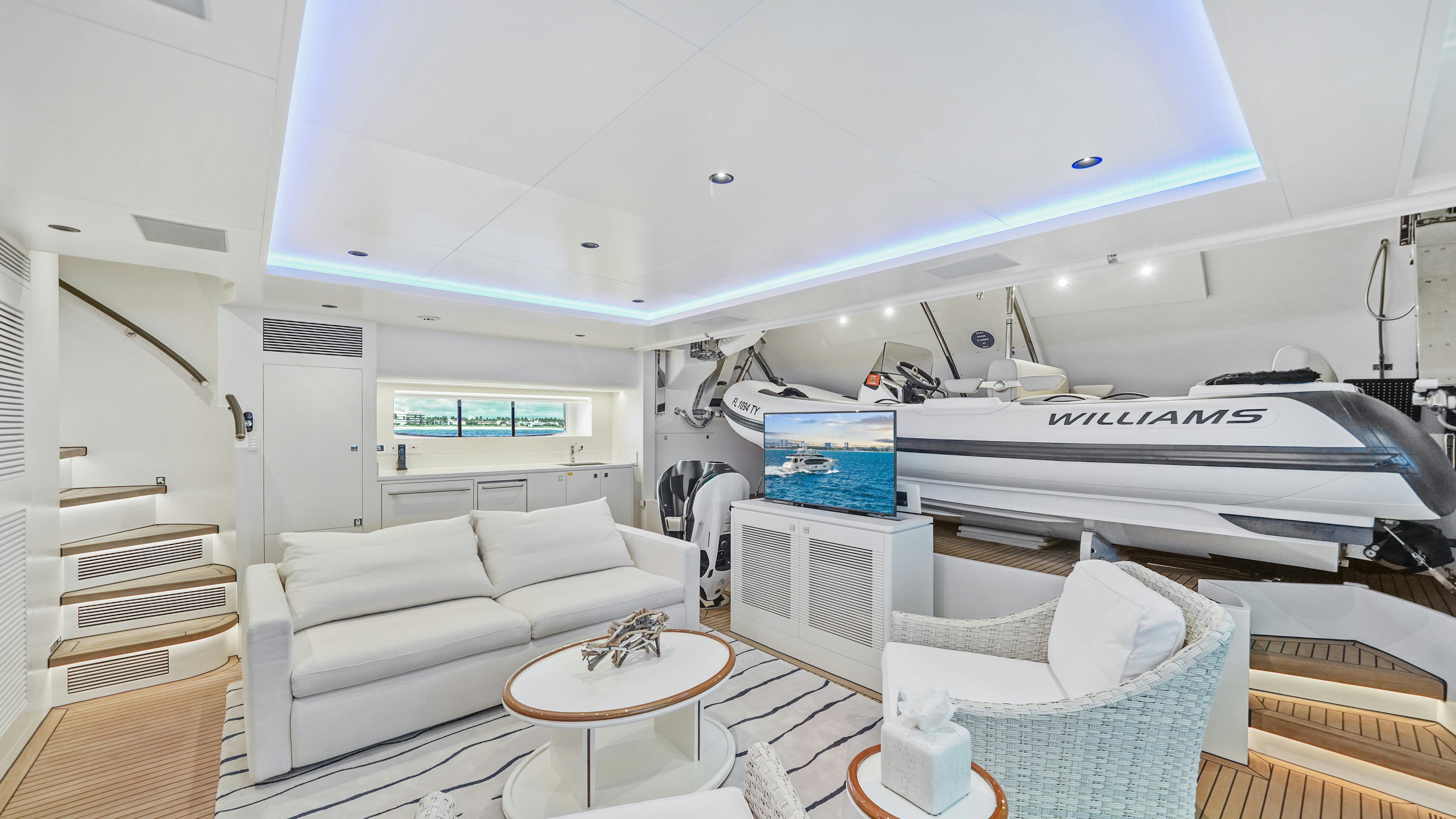 a white living room with a piano aboard MISS MICHELLE Yacht for Sale