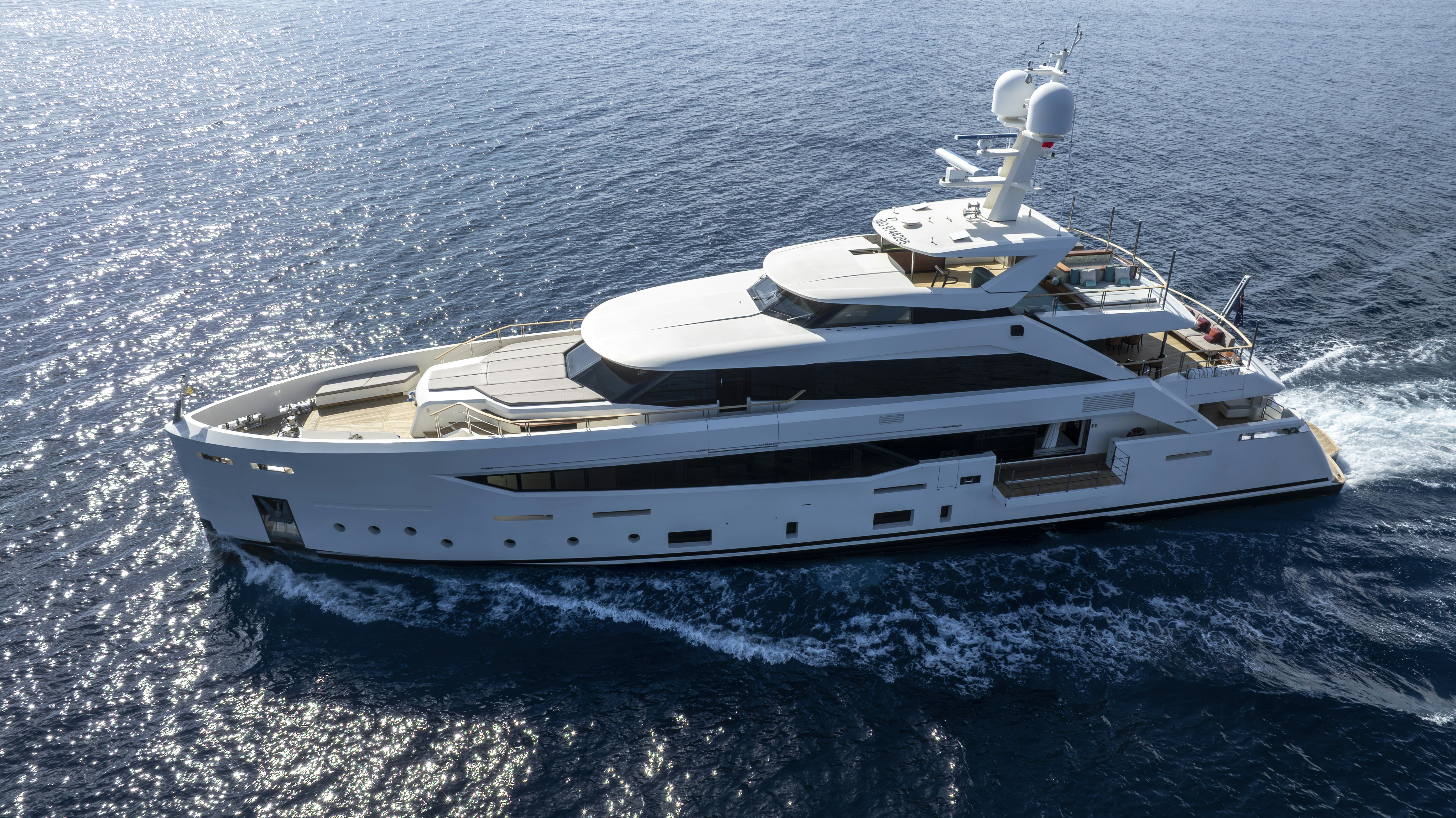 a white yacht in the ocean aboard SERENITY Yacht for Sale