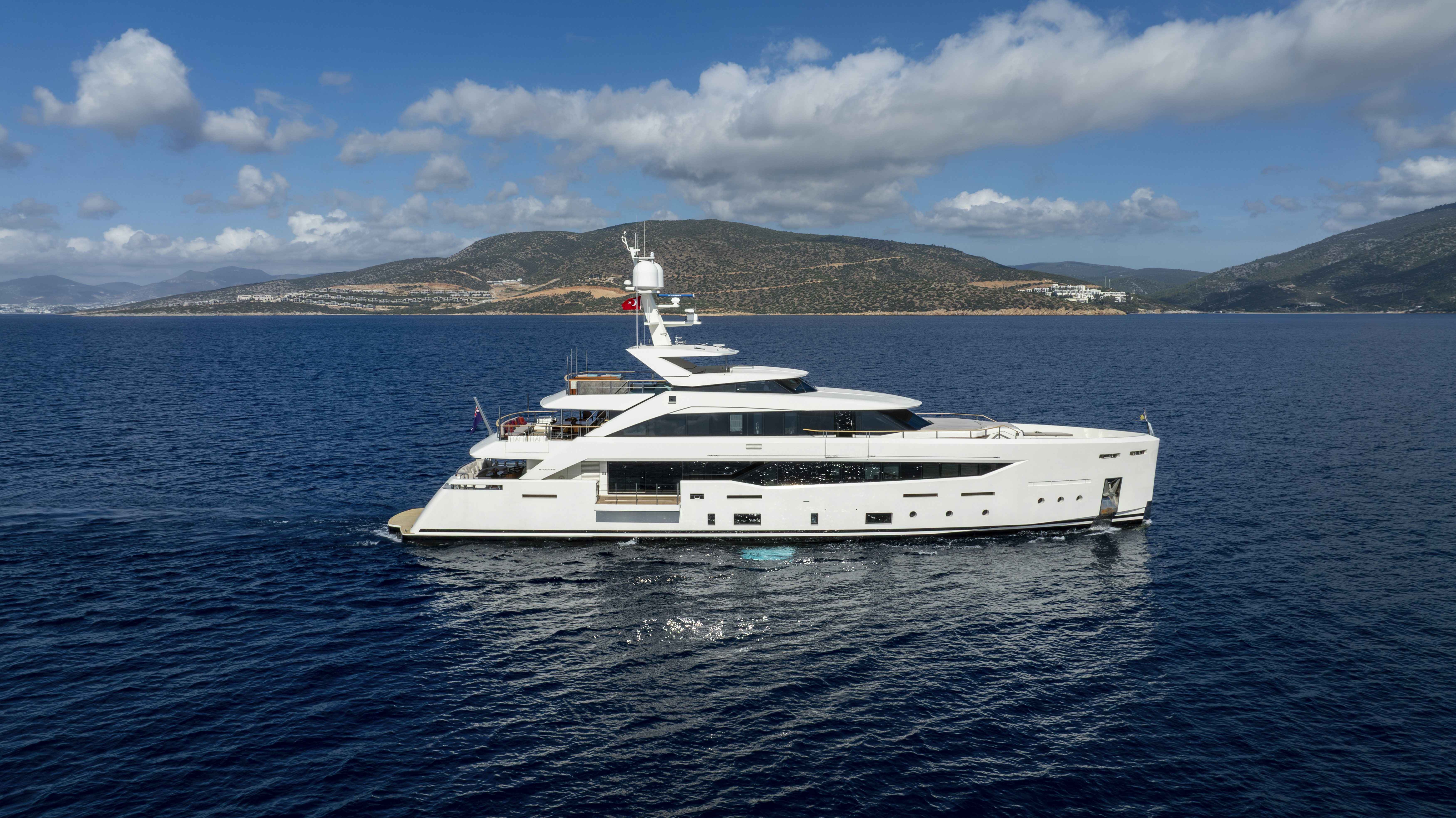 a white yacht in the water aboard SERENITY Yacht for Sale