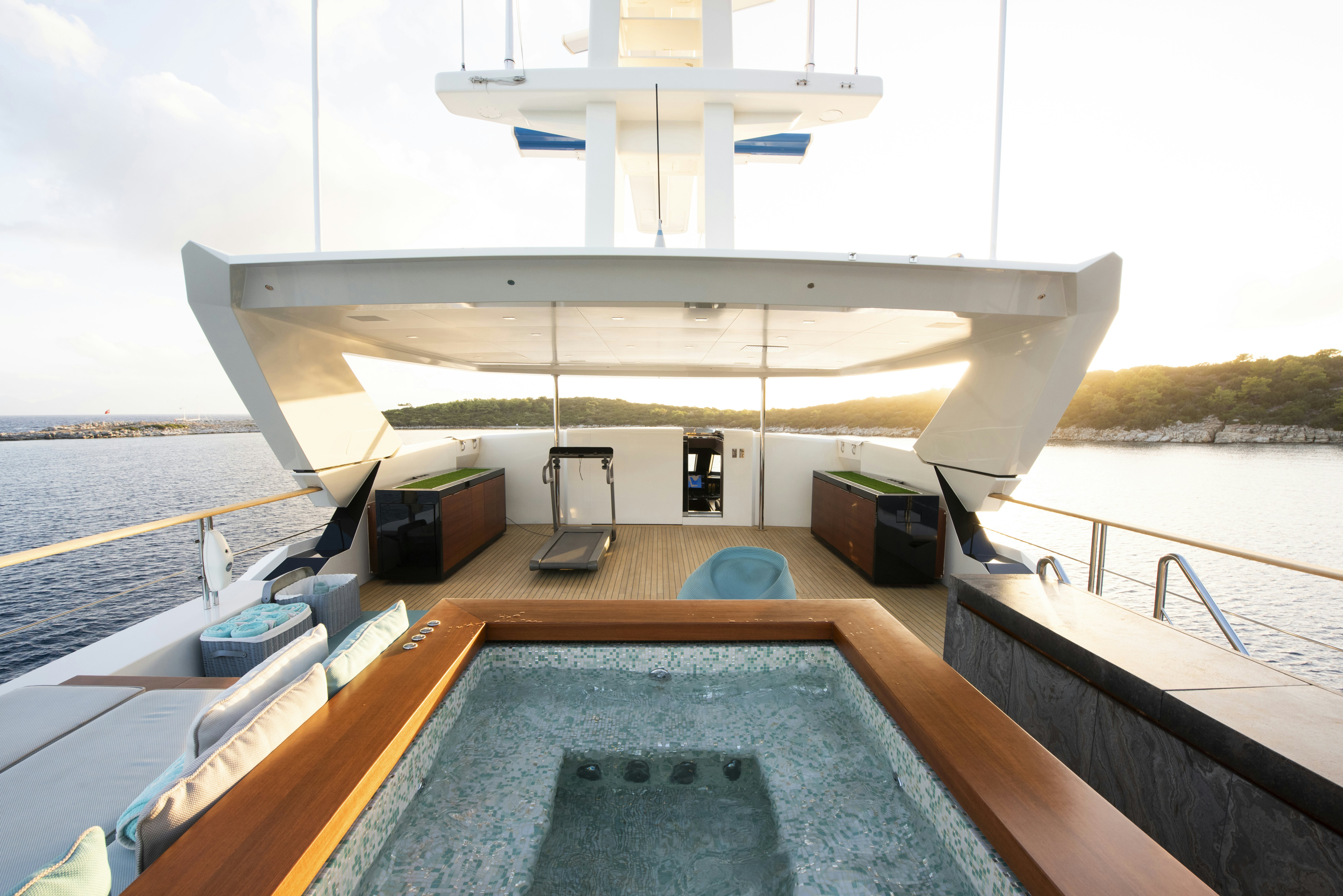 a large white building with a pool aboard SERENITY Yacht for Sale