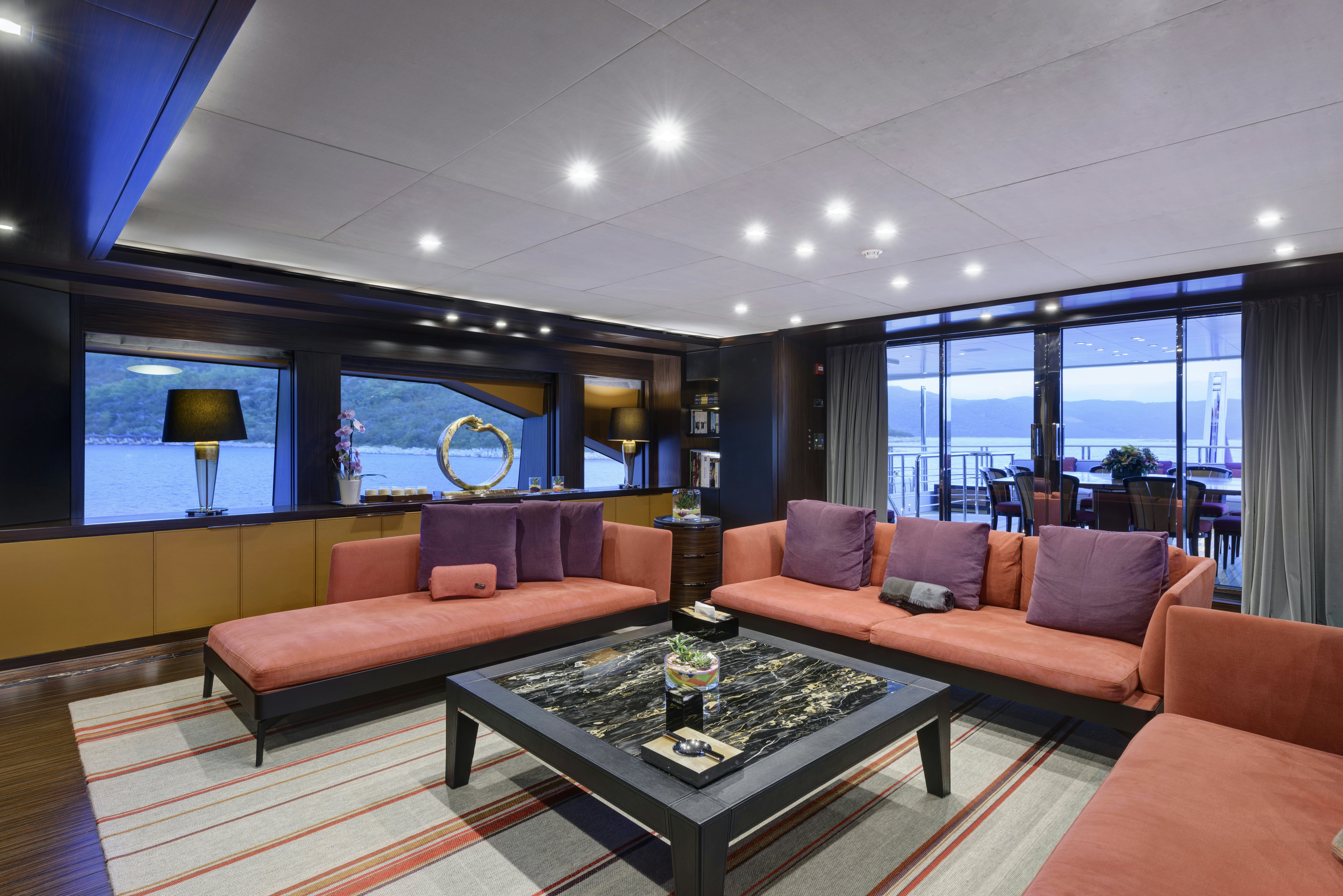 a living room with a large window aboard SERENITY Yacht for Sale