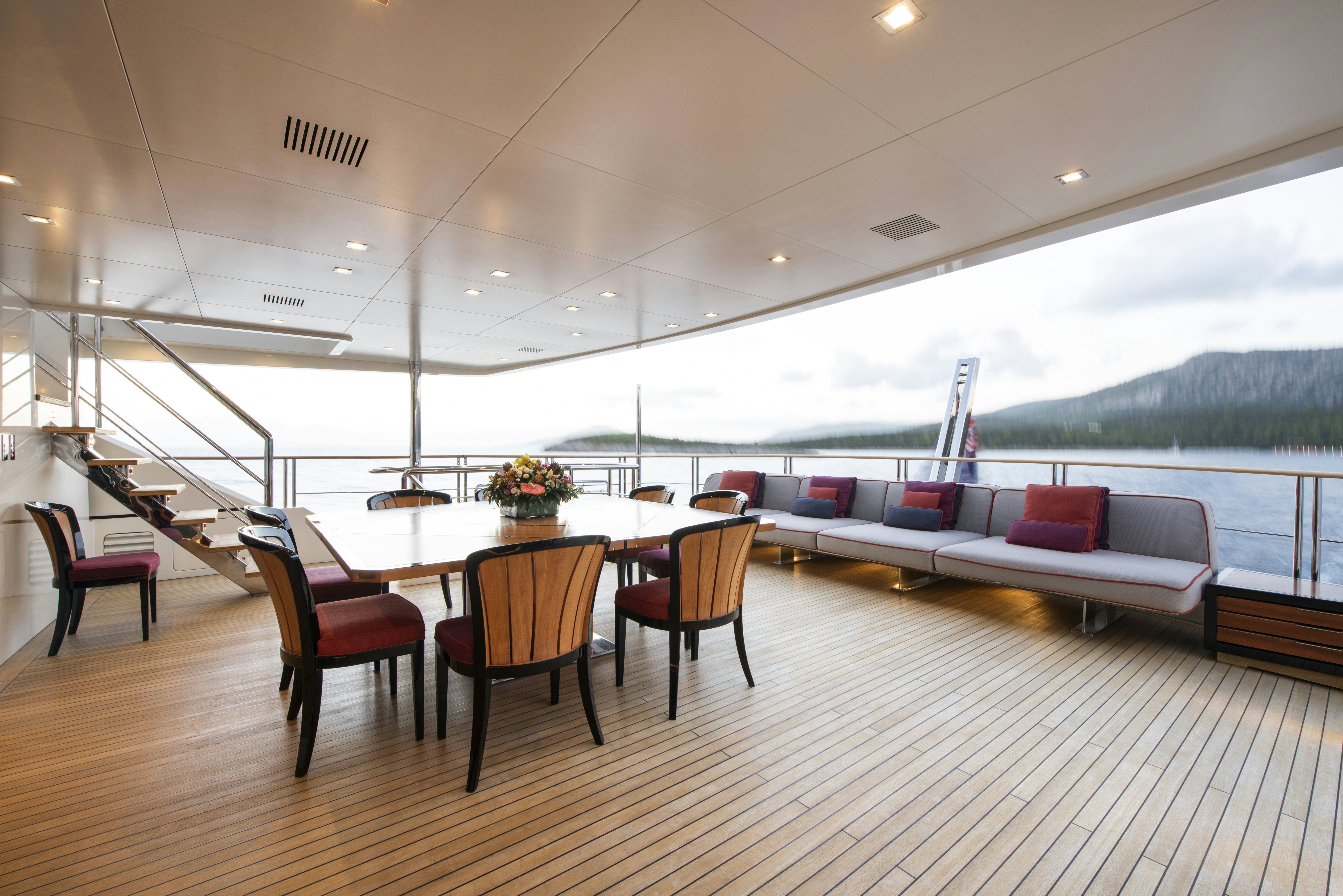 a room with a table and chairs aboard SERENITY Yacht for Sale