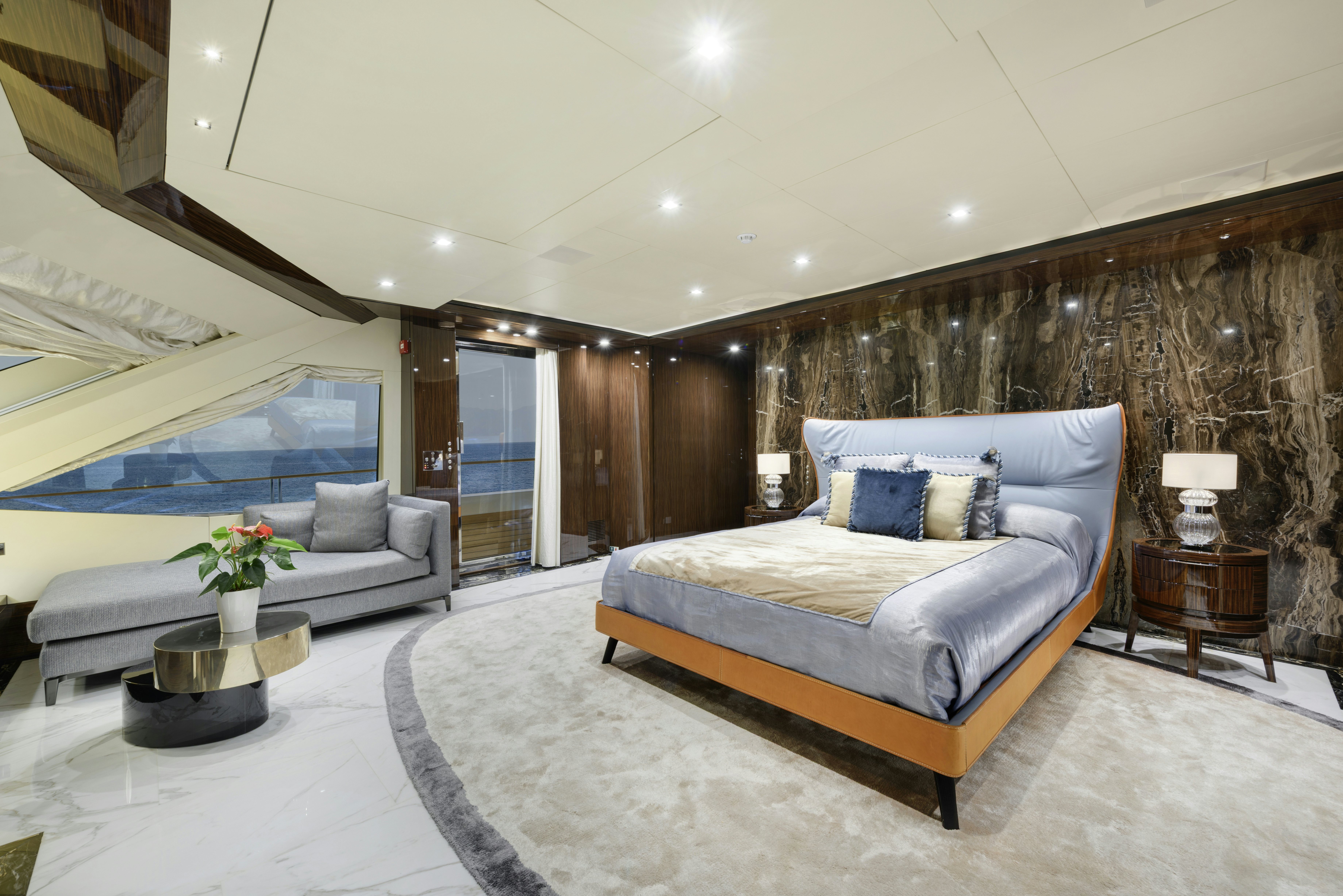 a large bedroom with a large bed aboard SERENITY Yacht for Sale