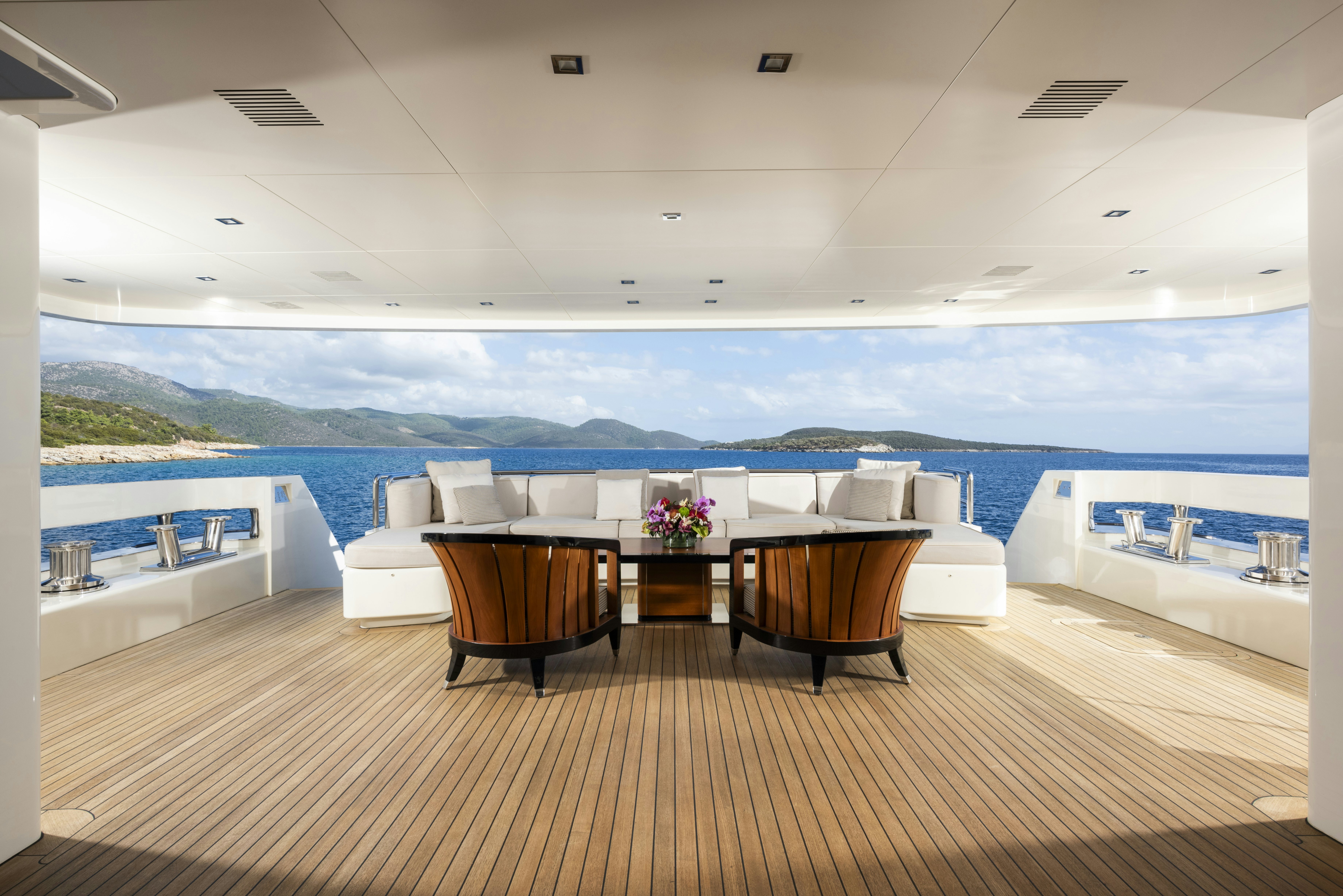 a room with a table and chairs aboard SERENITY Yacht for Sale