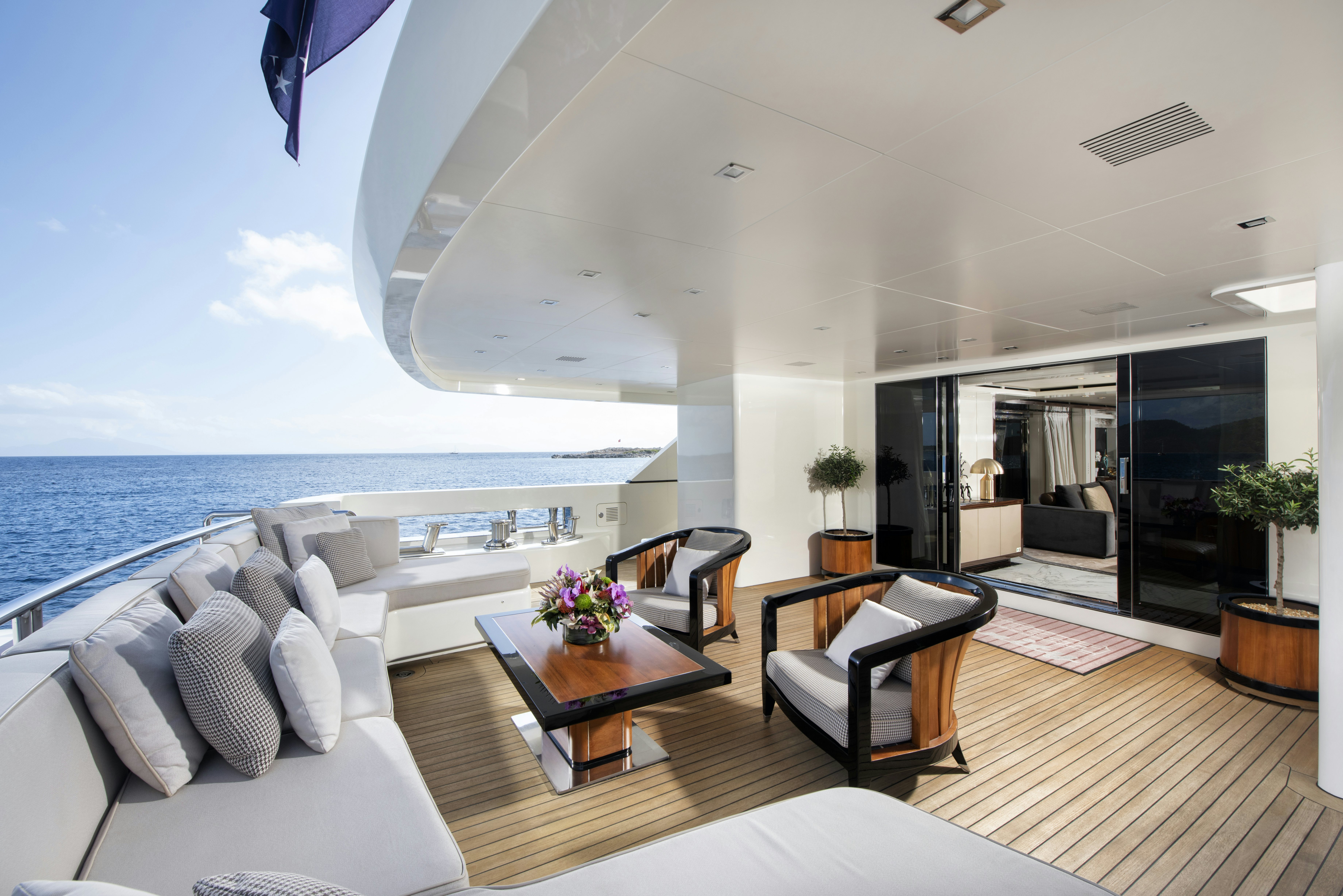 a room with a large balcony aboard SERENITY Yacht for Sale