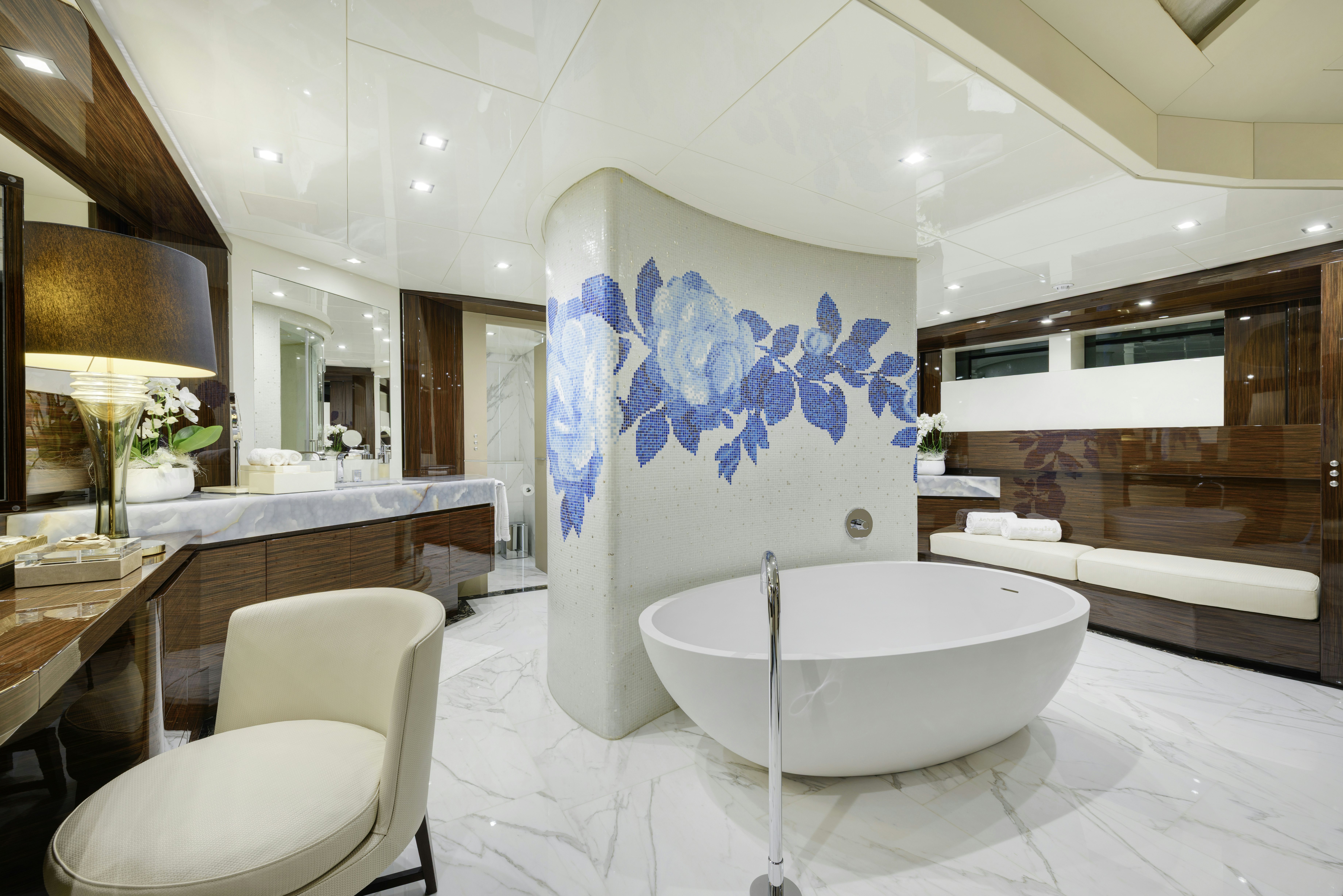 a large white bathroom with a large white tub aboard SERENITY Yacht for Sale