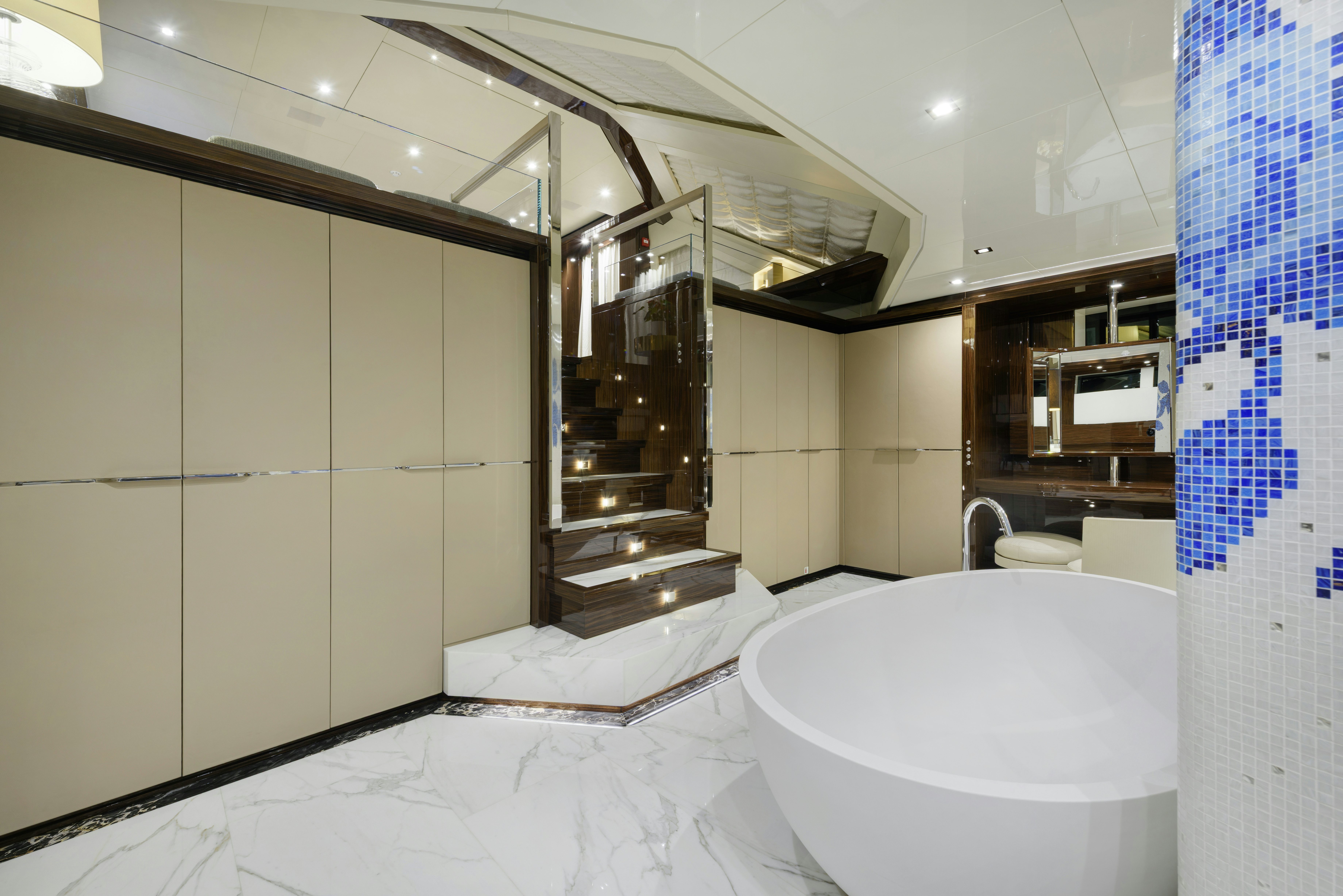 a bathroom with a glass shower aboard SERENITY Yacht for Sale