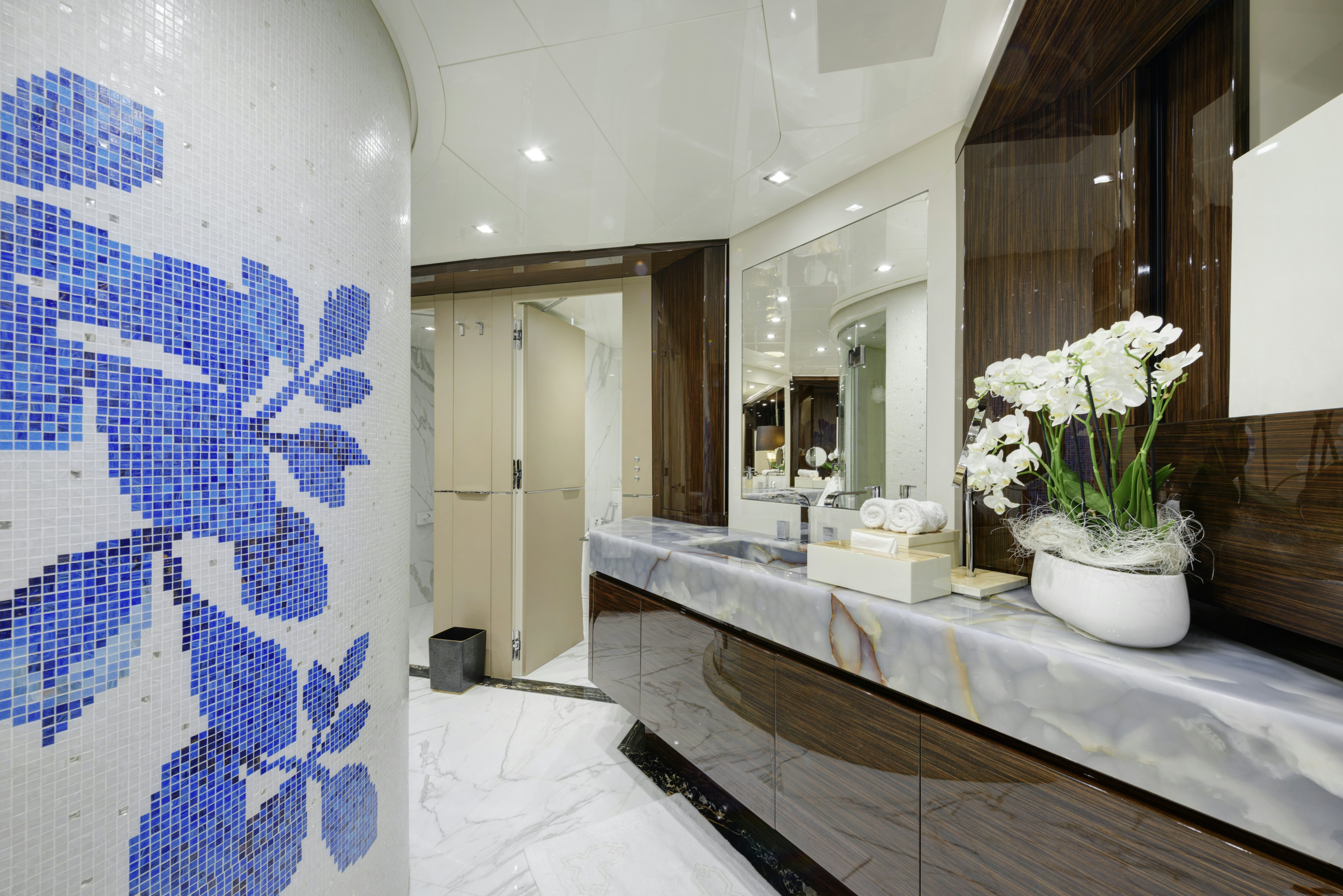 a bathroom with a large mirror aboard SERENITY Yacht for Sale