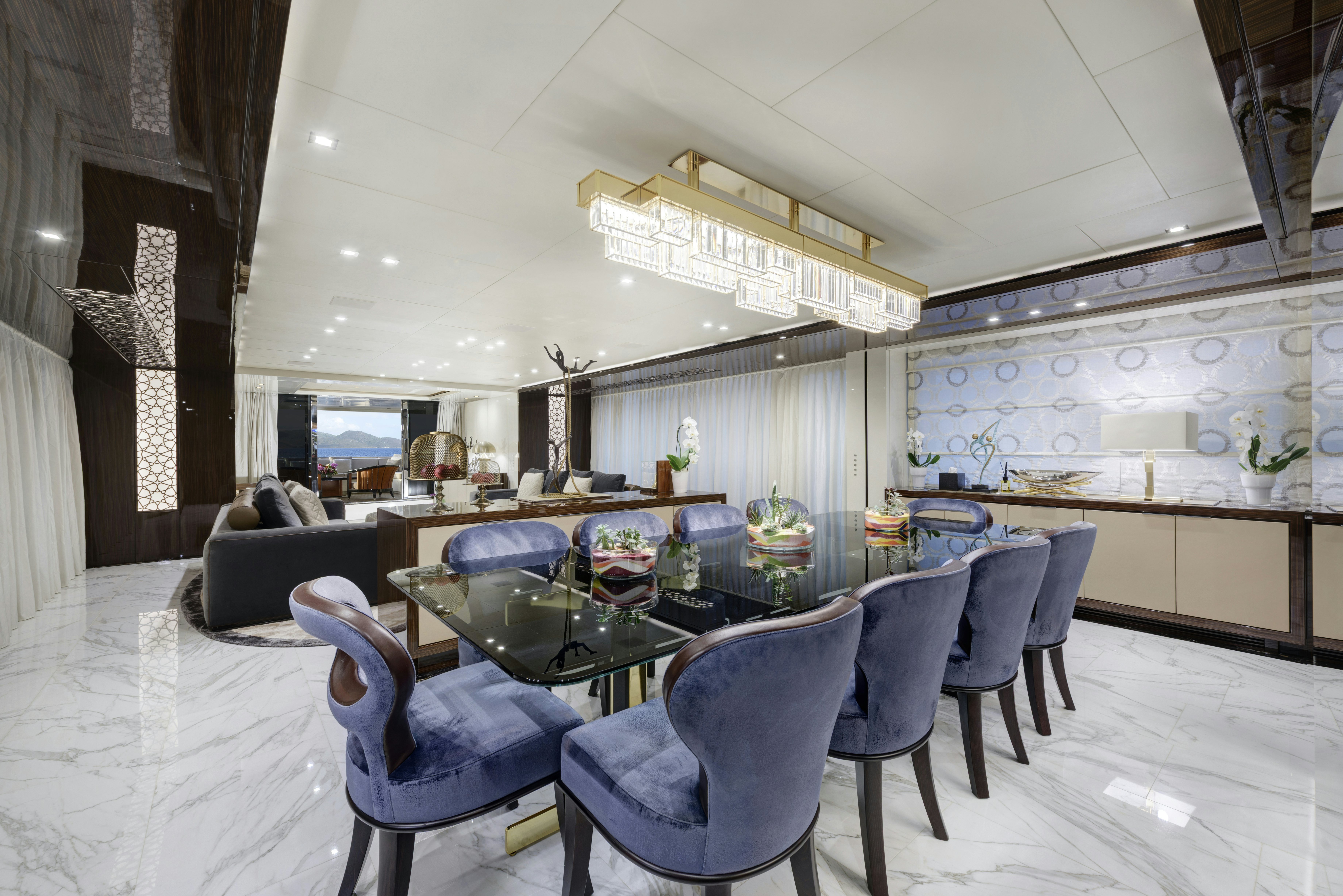 a large dining room with a table and chairs aboard SERENITY Yacht for Sale