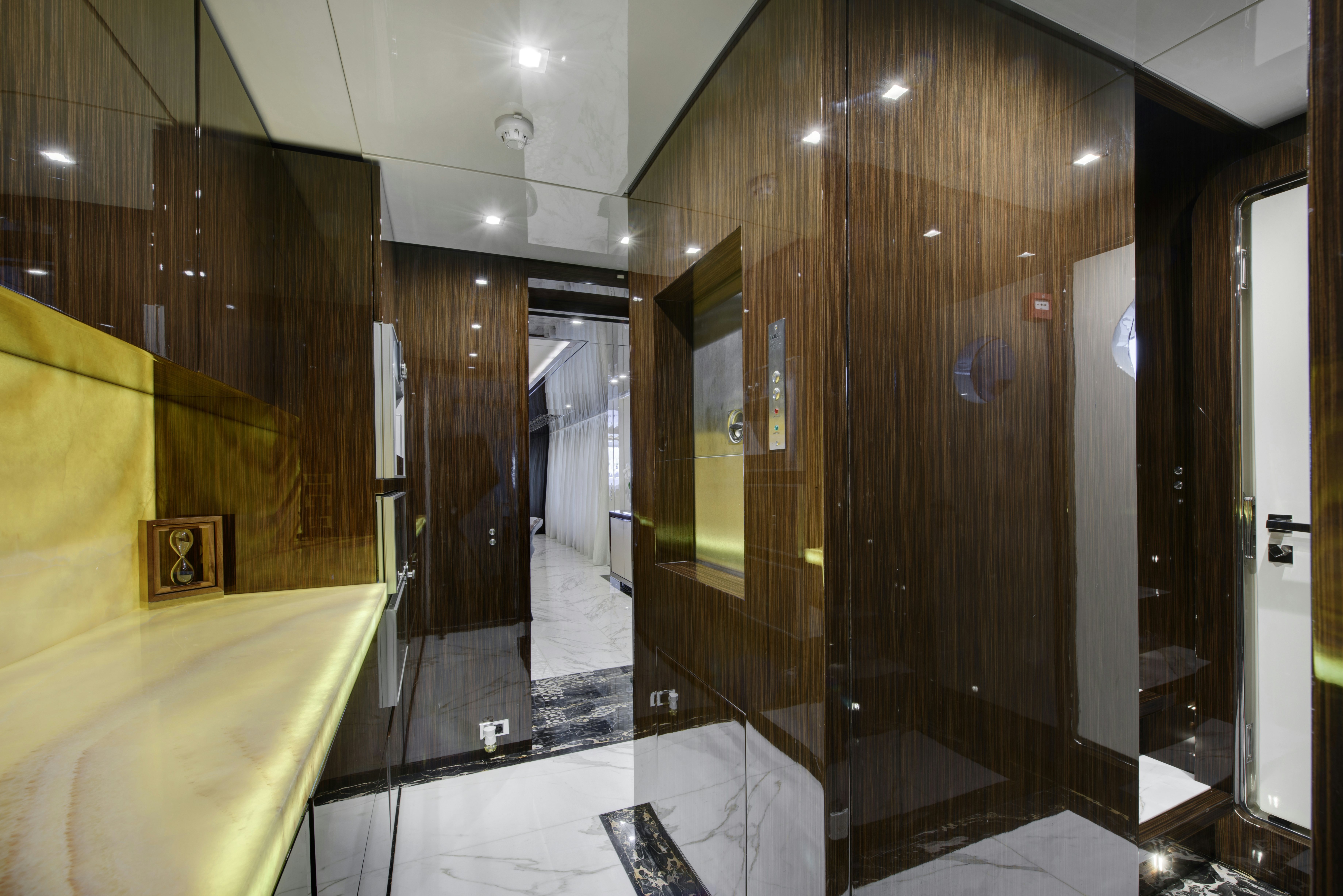 a large bathroom with a glass shower aboard SERENITY Yacht for Sale