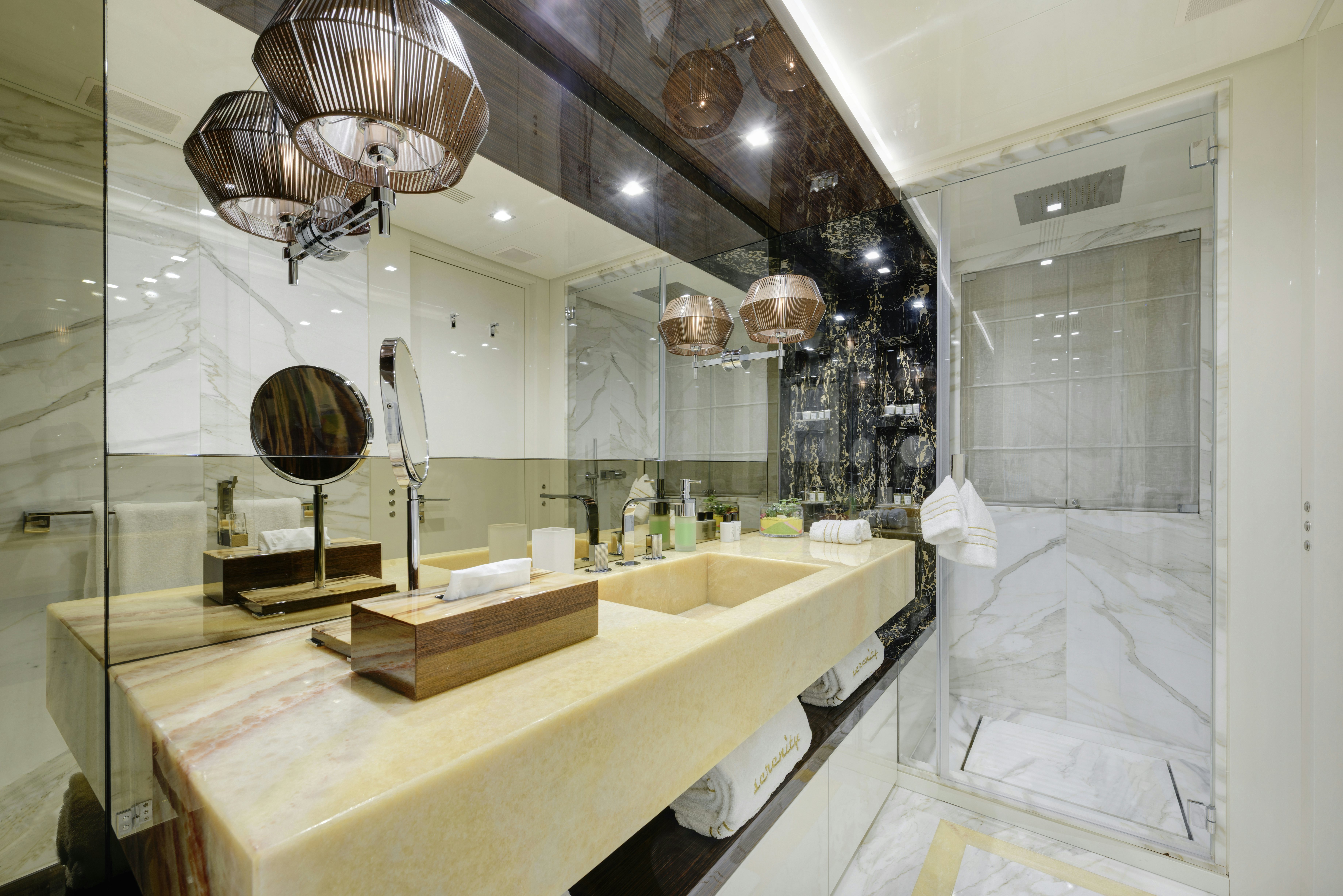 a bathroom with a large mirror aboard SERENITY Yacht for Sale
