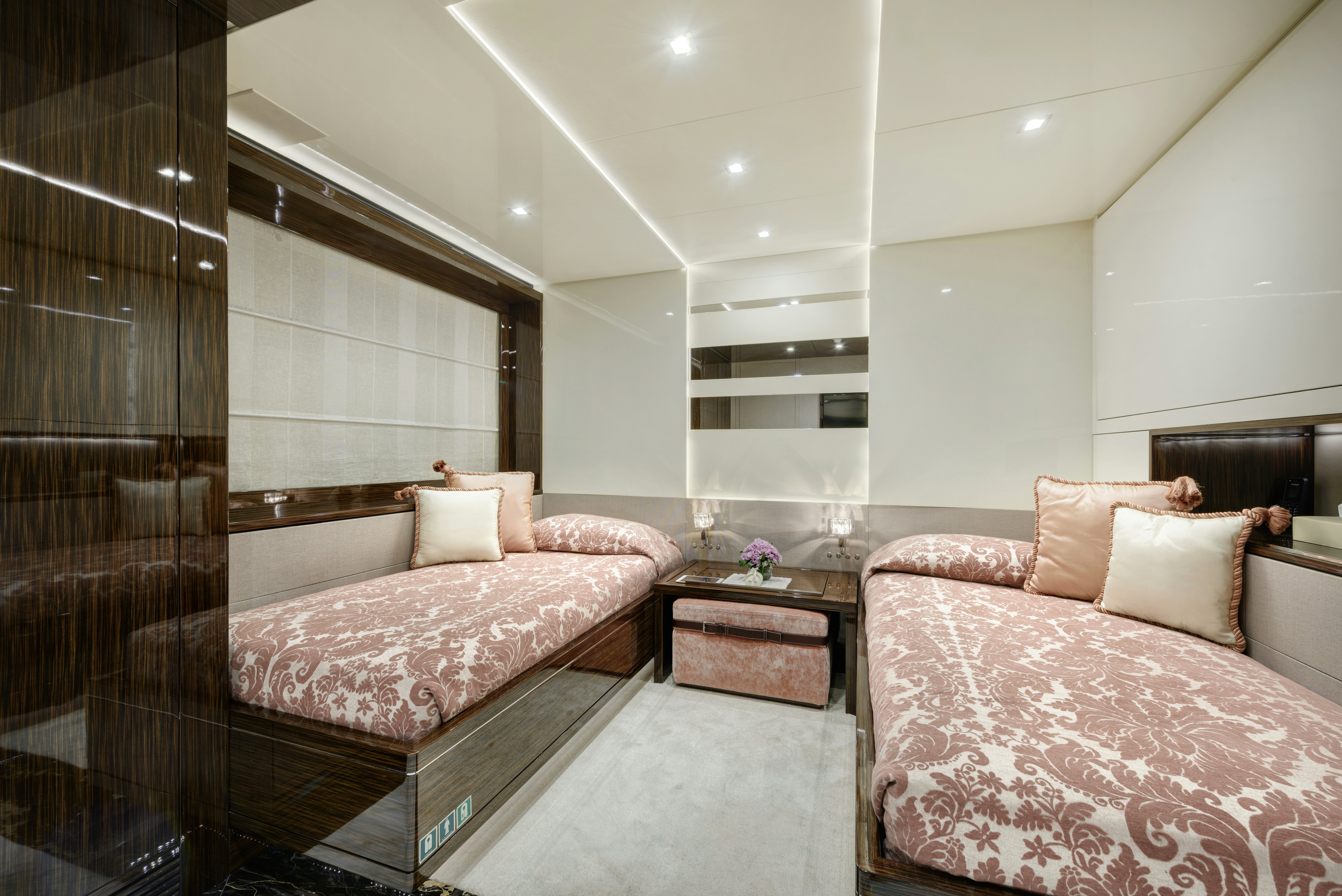 a room with a bed and a table aboard SERENITY Yacht for Sale