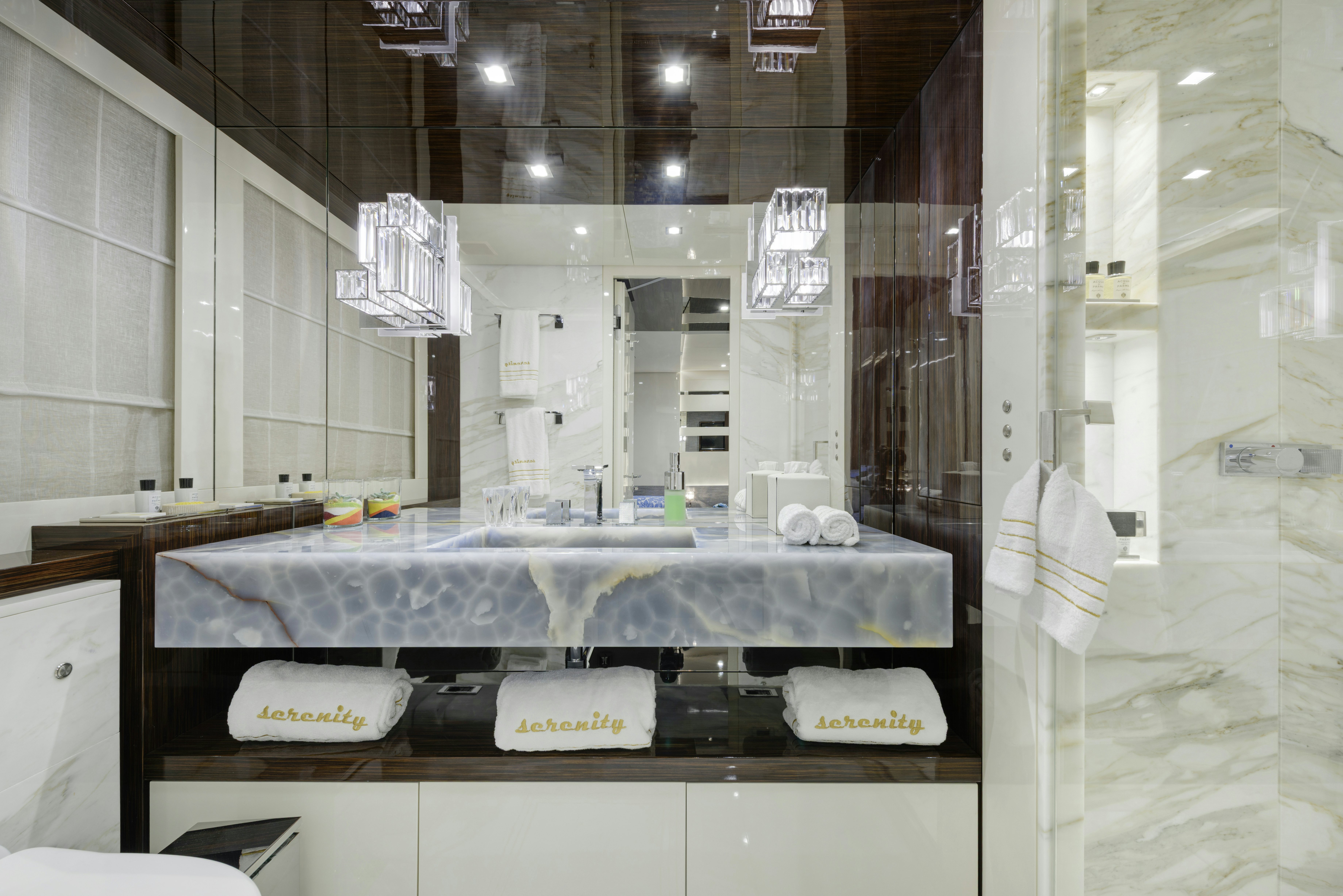 a counter with a sink and a mirror aboard SERENITY Yacht for Sale