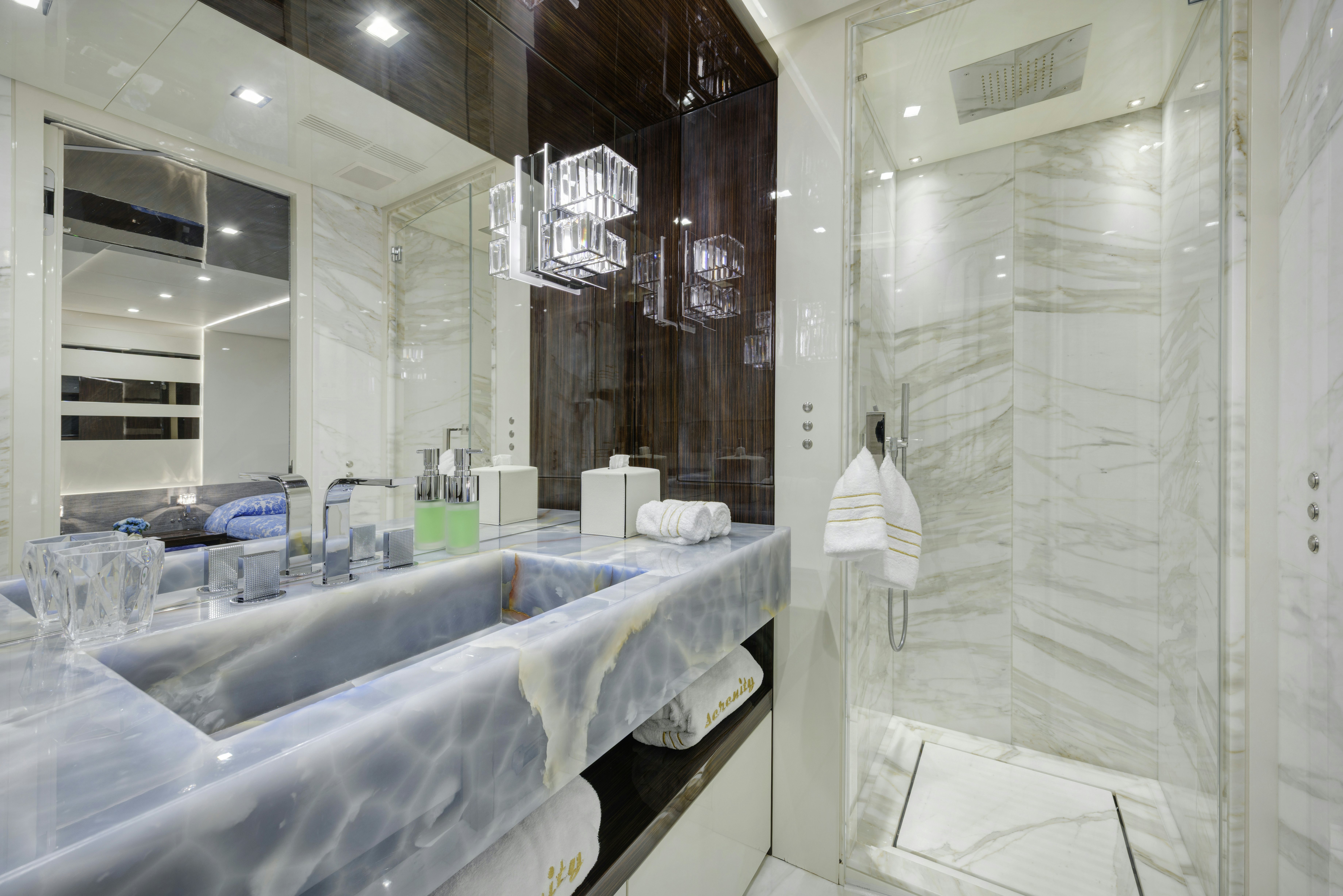 a bathroom with a large bathtub aboard SERENITY Yacht for Sale
