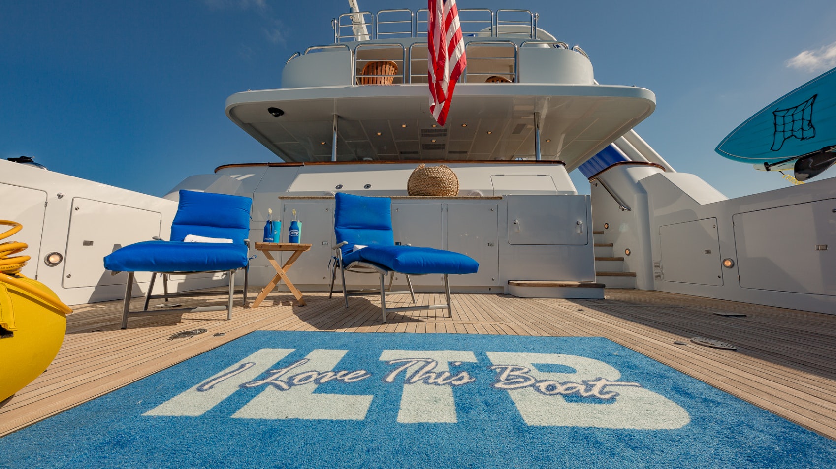 a plane and chairs on a deck aboard I LOVE THIS BOAT Yacht for Sale