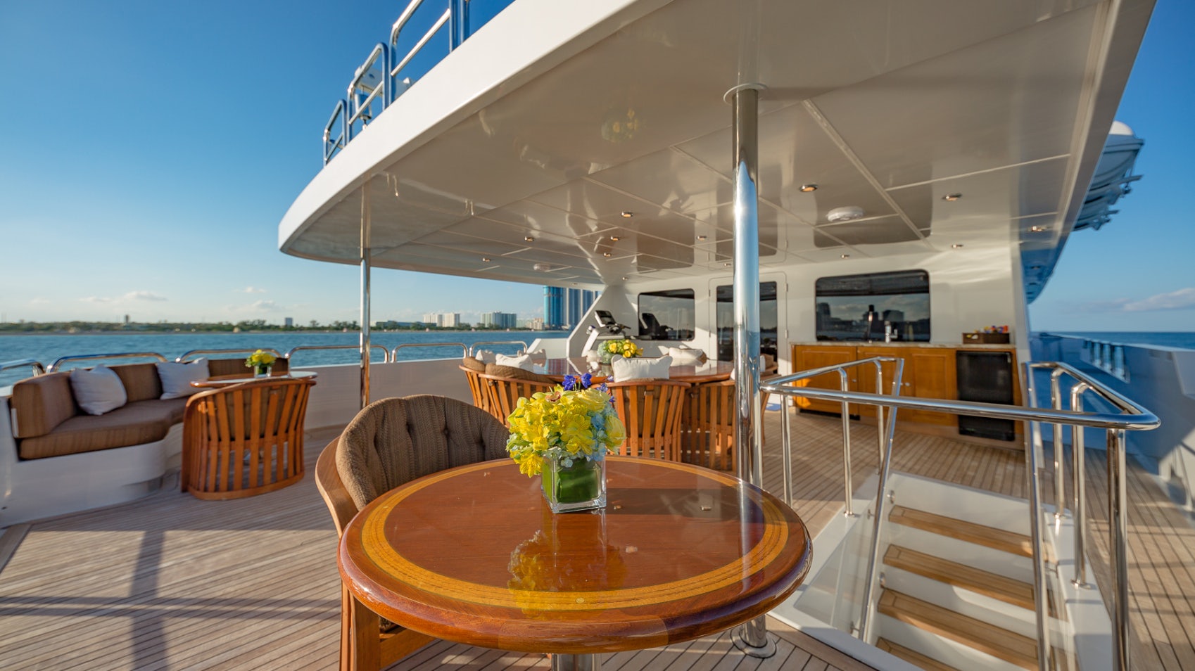 a table on a deck aboard I LOVE THIS BOAT Yacht for Sale