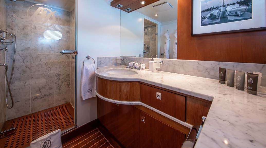 a bathroom with a sink and a shower aboard HEAVENLY DAZE Yacht for Charter