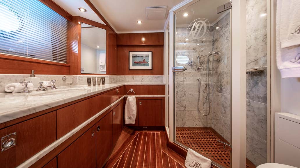 a bathroom with a shower and sink aboard HEAVENLY DAZE Yacht for Charter