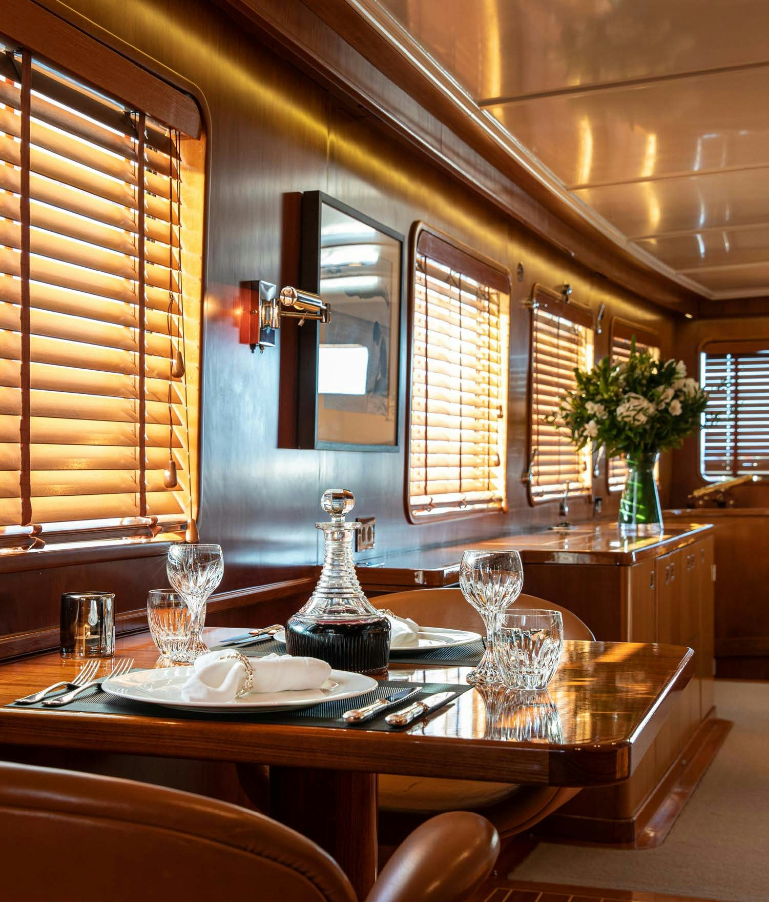 a dining room with a table and chairs aboard HEAVENLY DAZE Yacht for Charter