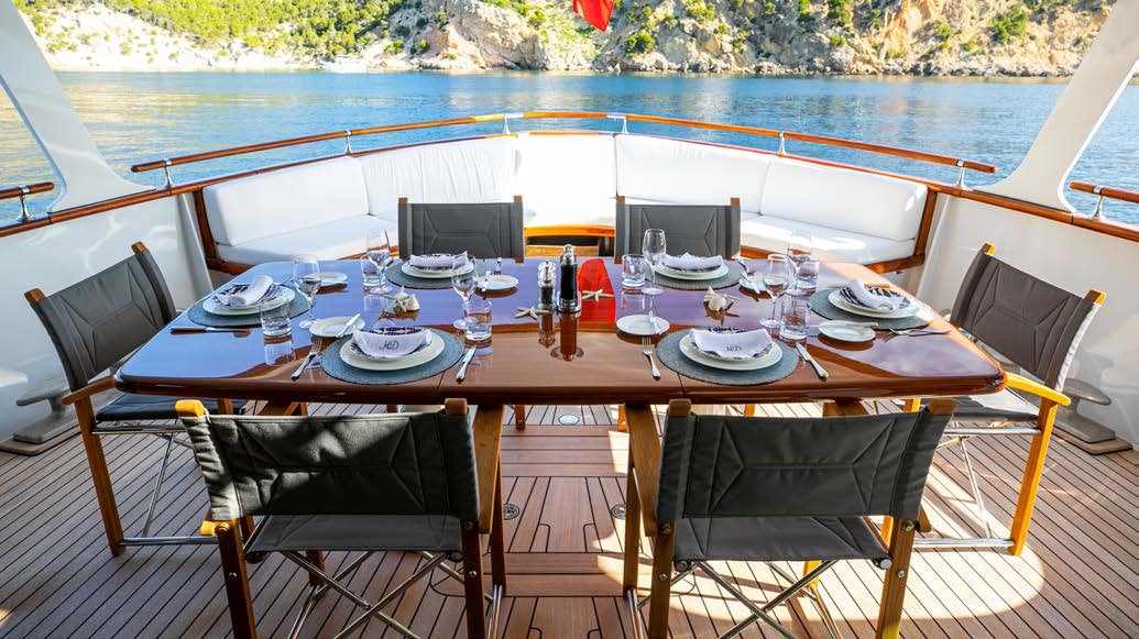 a table set for a dinner aboard HEAVENLY DAZE Yacht for Charter