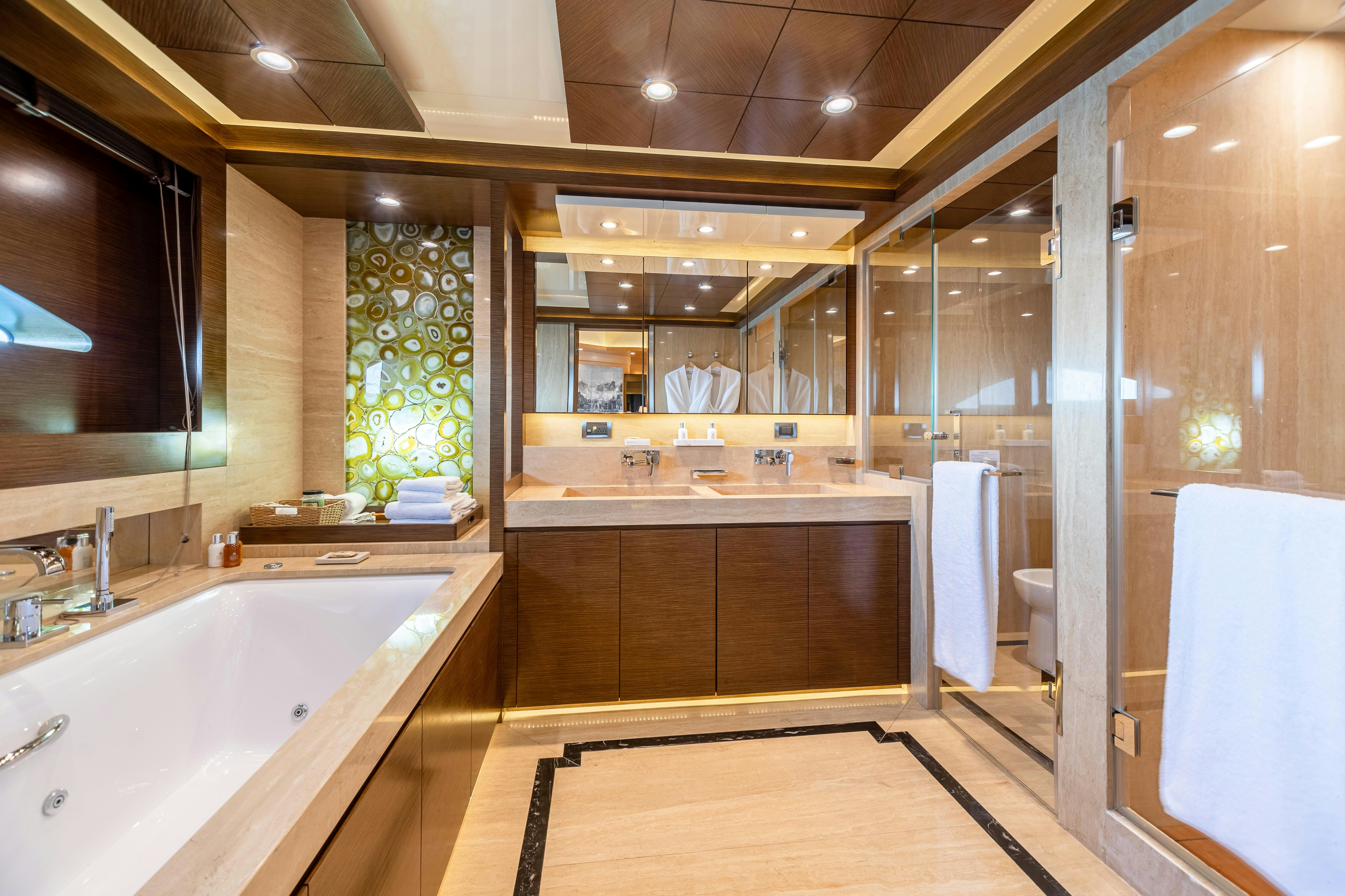a bathroom with a large tub aboard SWEET CAROLINE Yacht for Charter