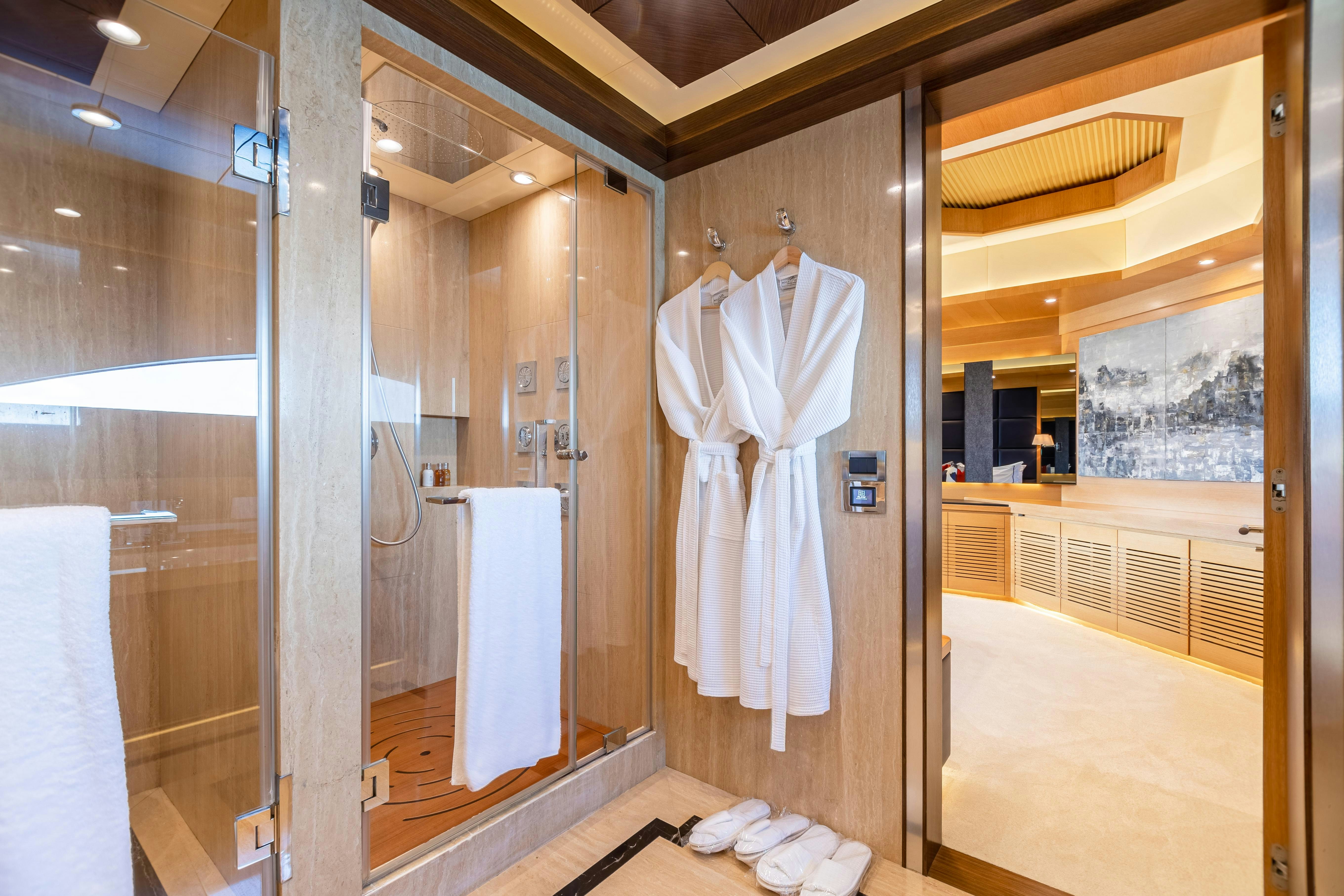 a bathroom with a large mirror aboard SWEET CAROLINE Yacht for Charter