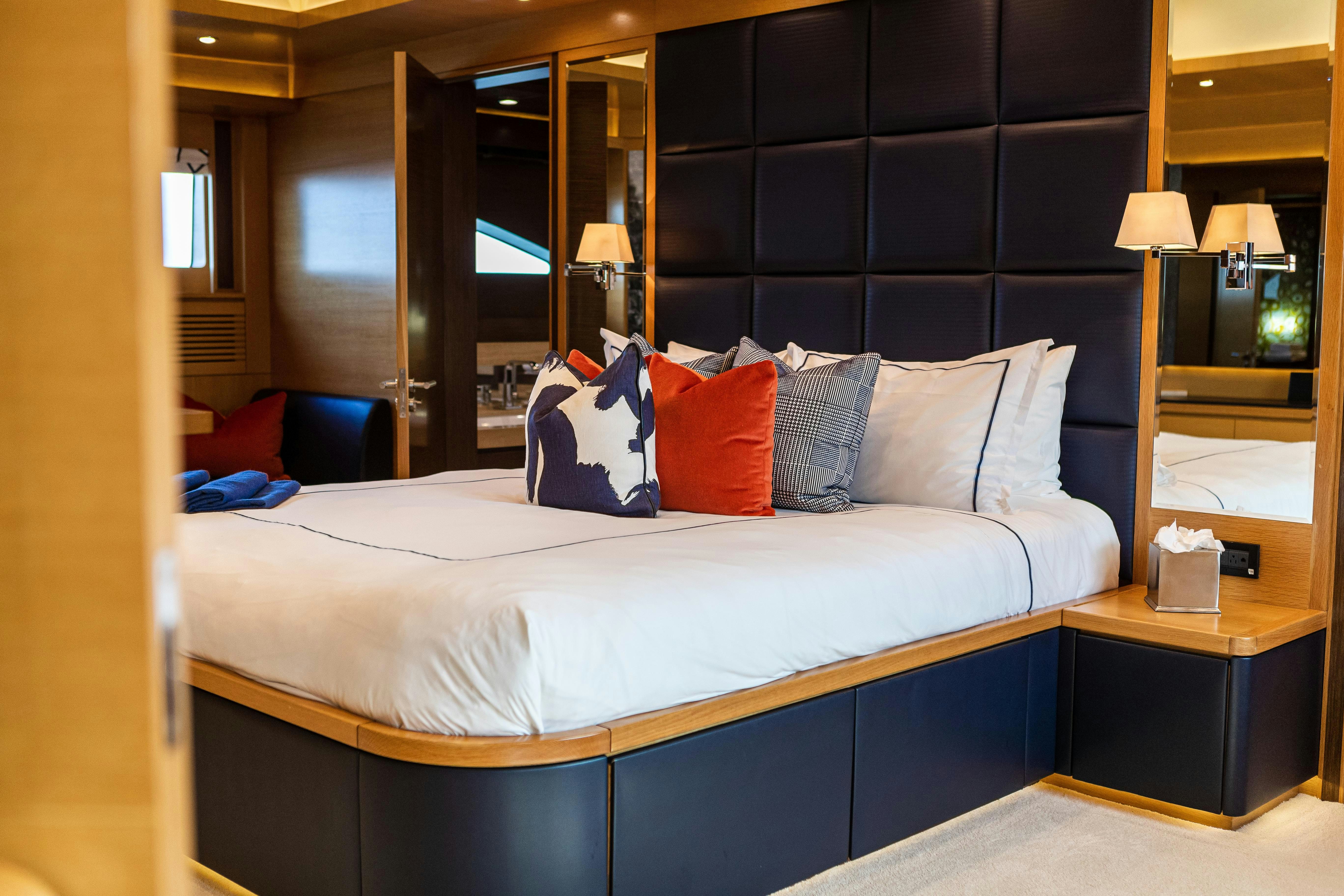 a bed with pillows aboard SWEET CAROLINE Yacht for Charter