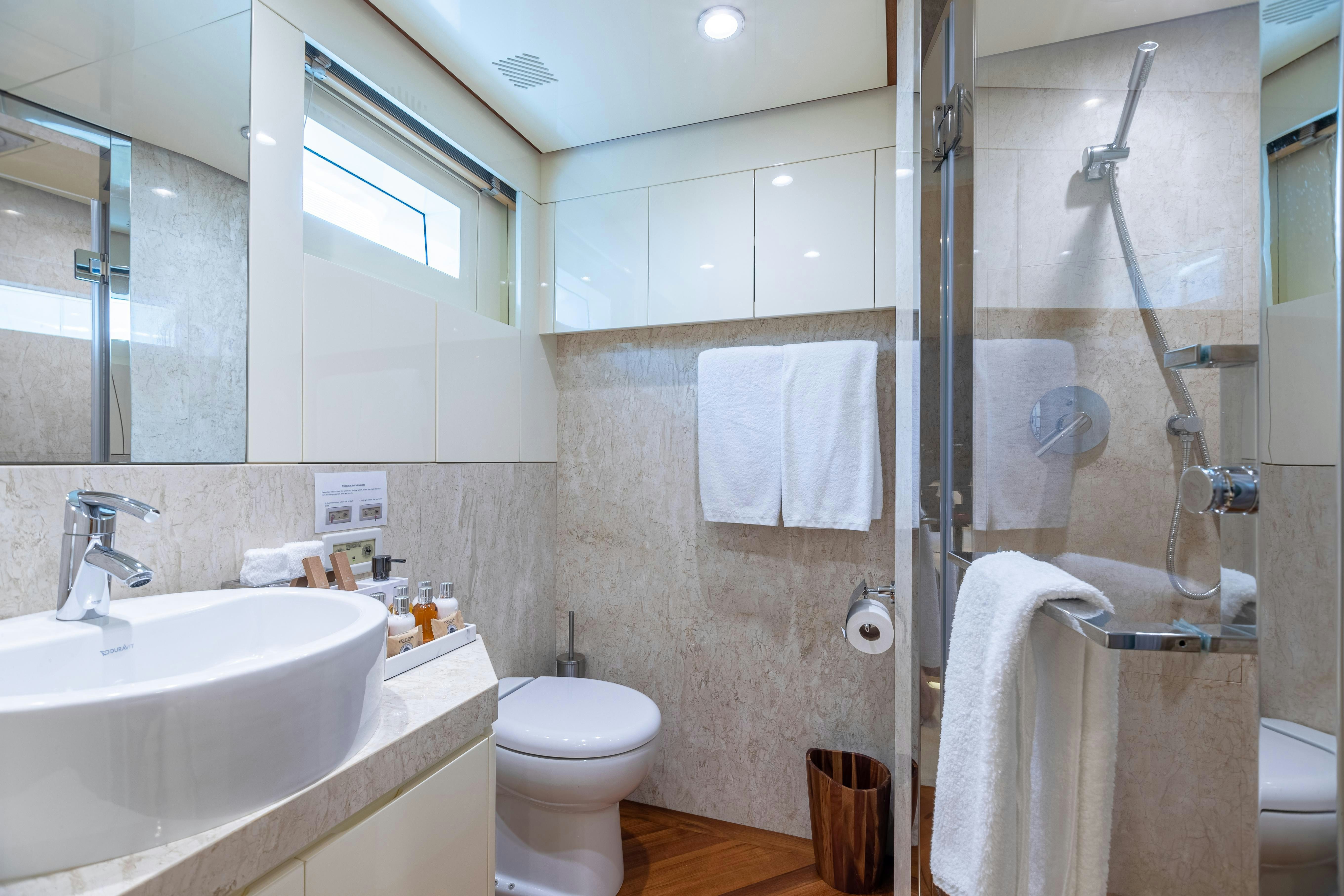 a bathroom with a shower and toilet aboard SWEET CAROLINE Yacht for Charter