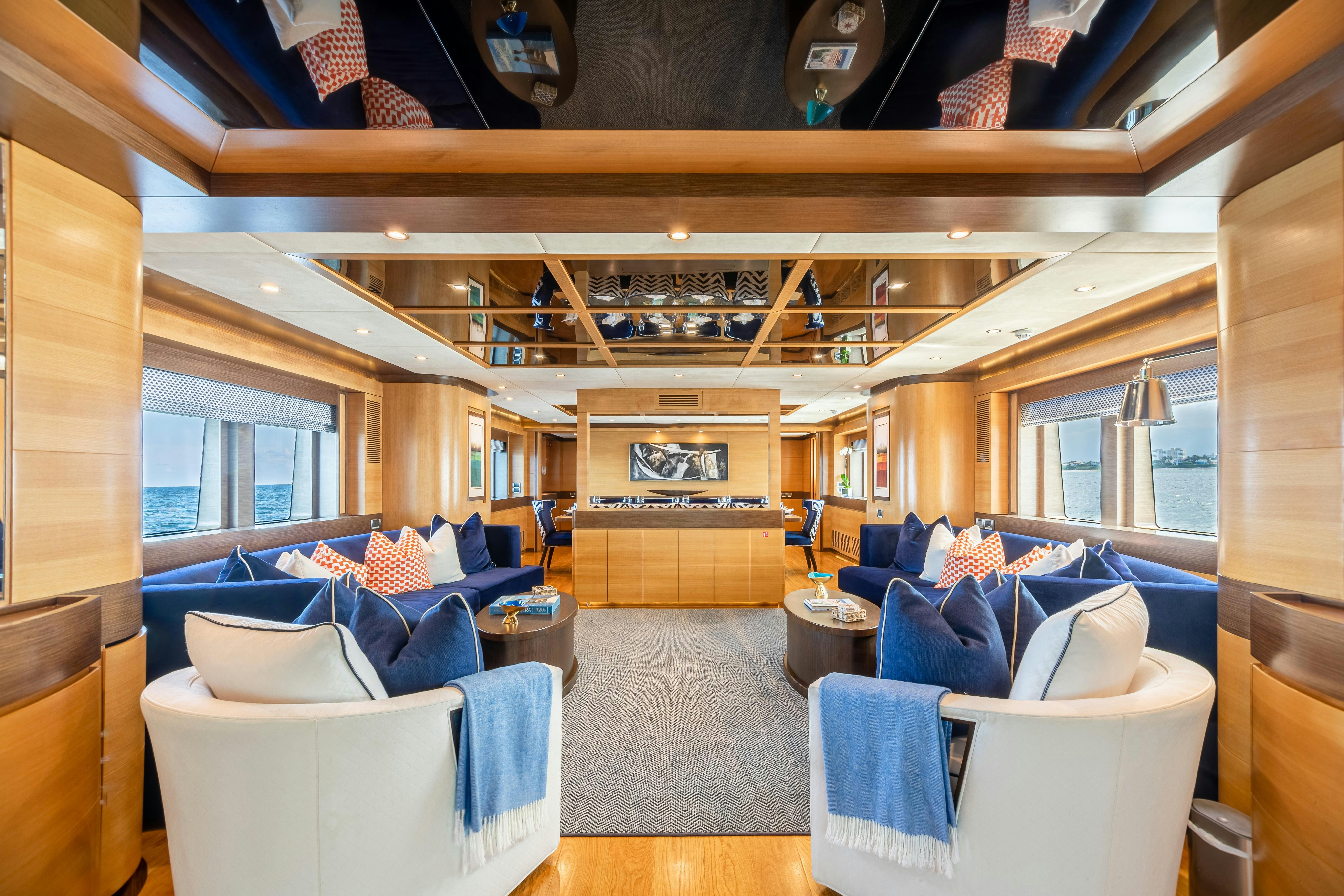a room with a couch and a table aboard SWEET CAROLINE Yacht for Charter