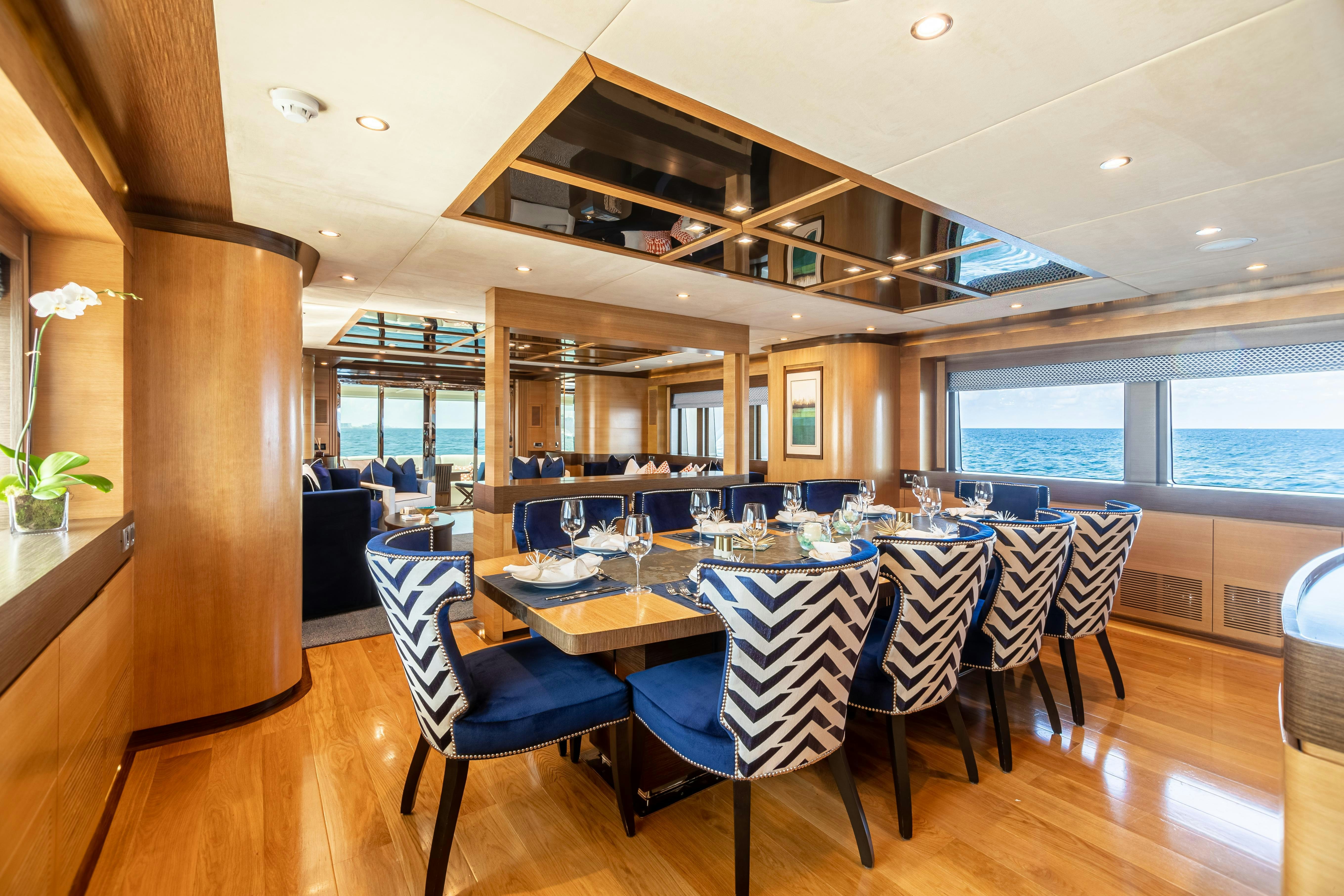 a dining room with a large table aboard SWEET CAROLINE Yacht for Charter