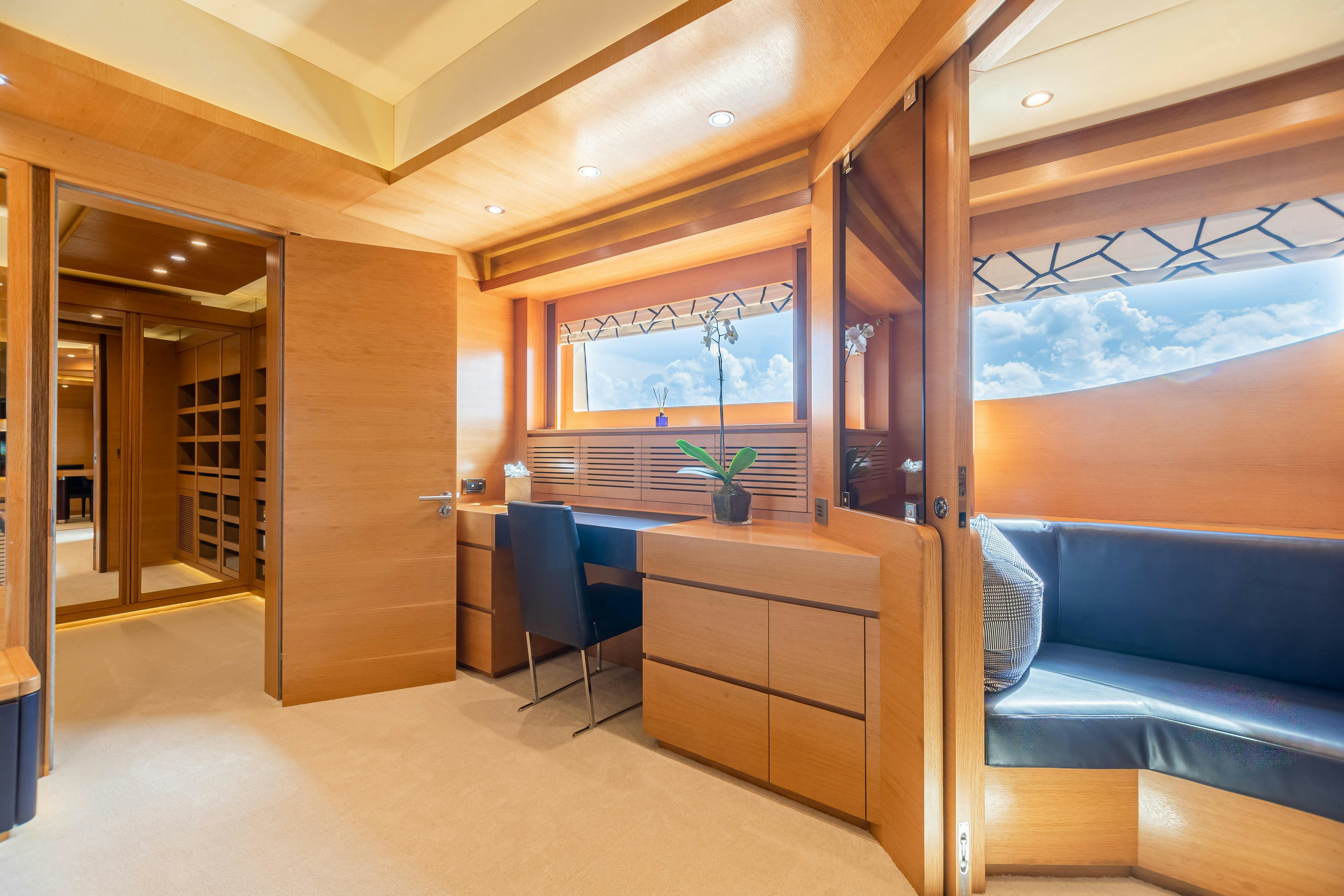 a room with a desk and a chair aboard SWEET CAROLINE Yacht for Charter