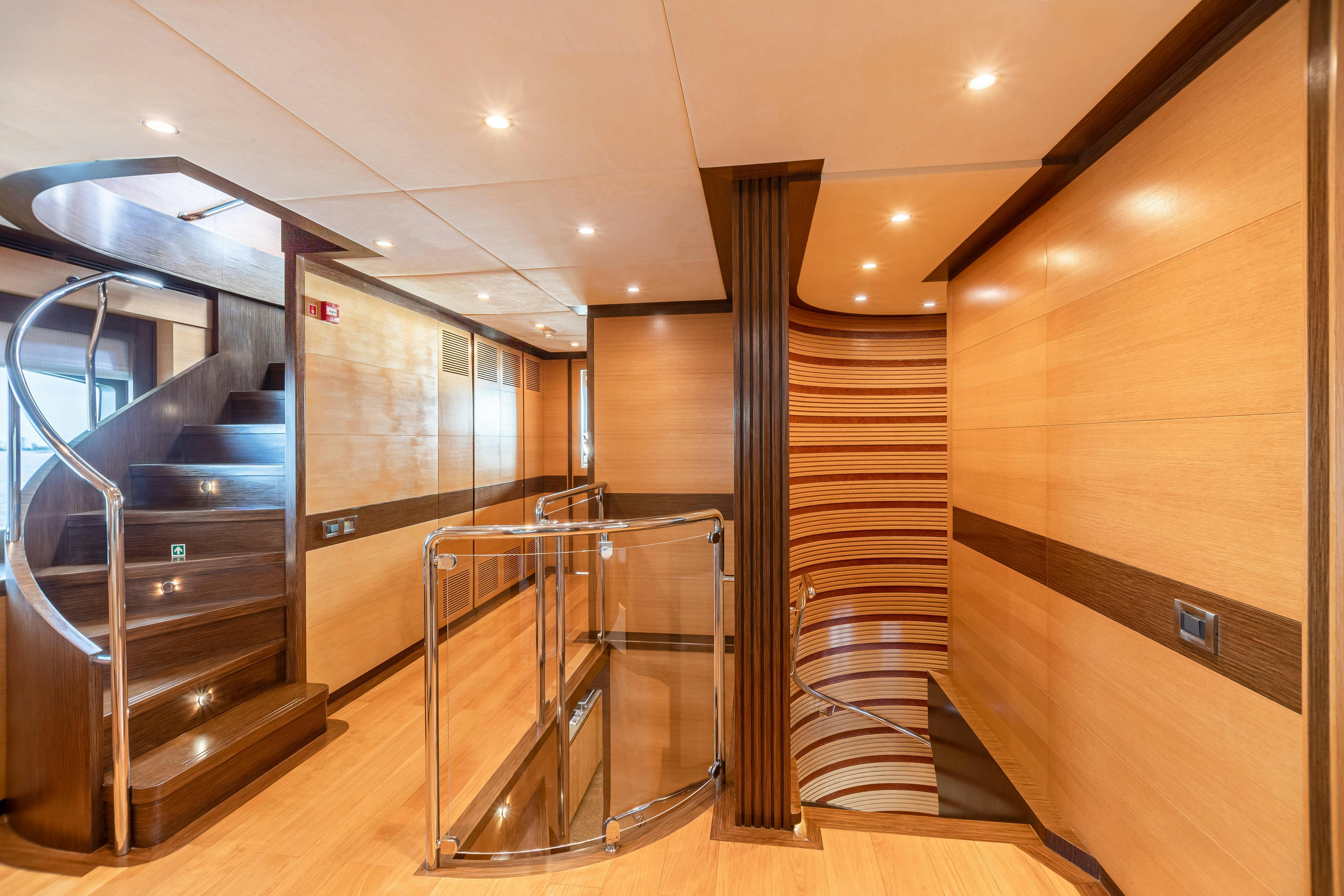 a modern looking staircase in a house aboard SWEET CAROLINE Yacht for Charter