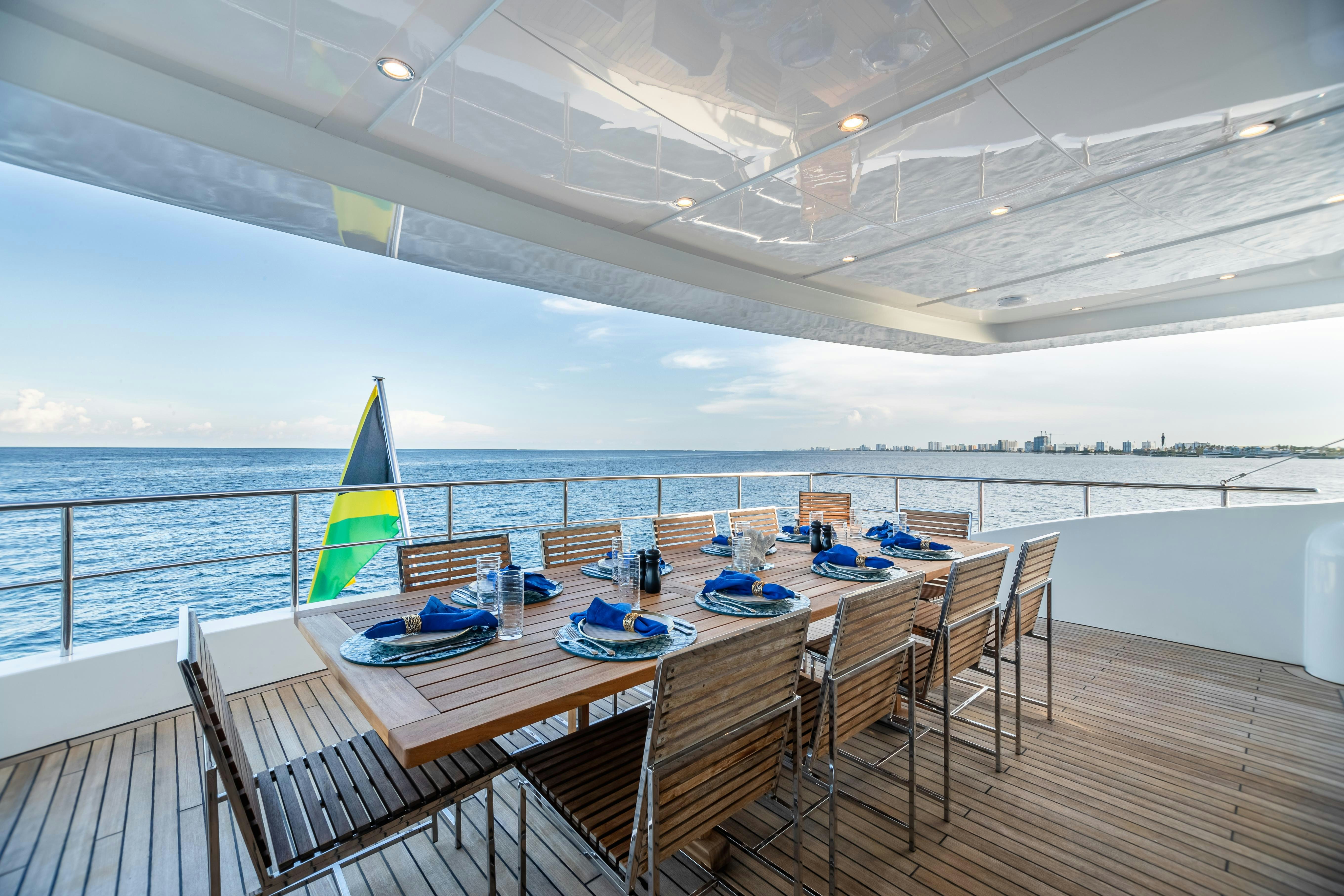 a table and chairs on a deck aboard SWEET CAROLINE Yacht for Charter