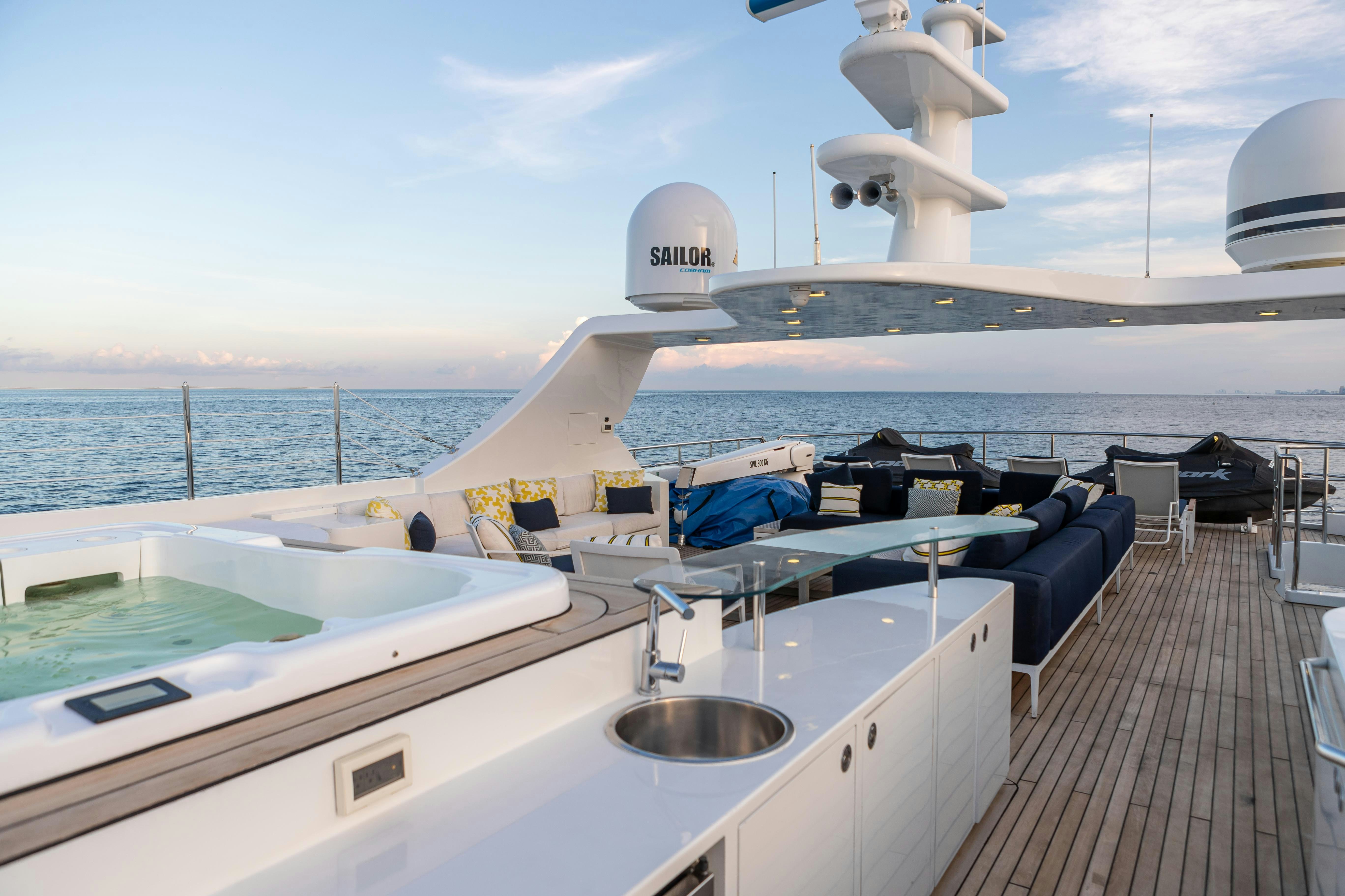 a large white boat with a sink and a large white building on the side of it aboard SWEET CAROLINE Yacht for Charter