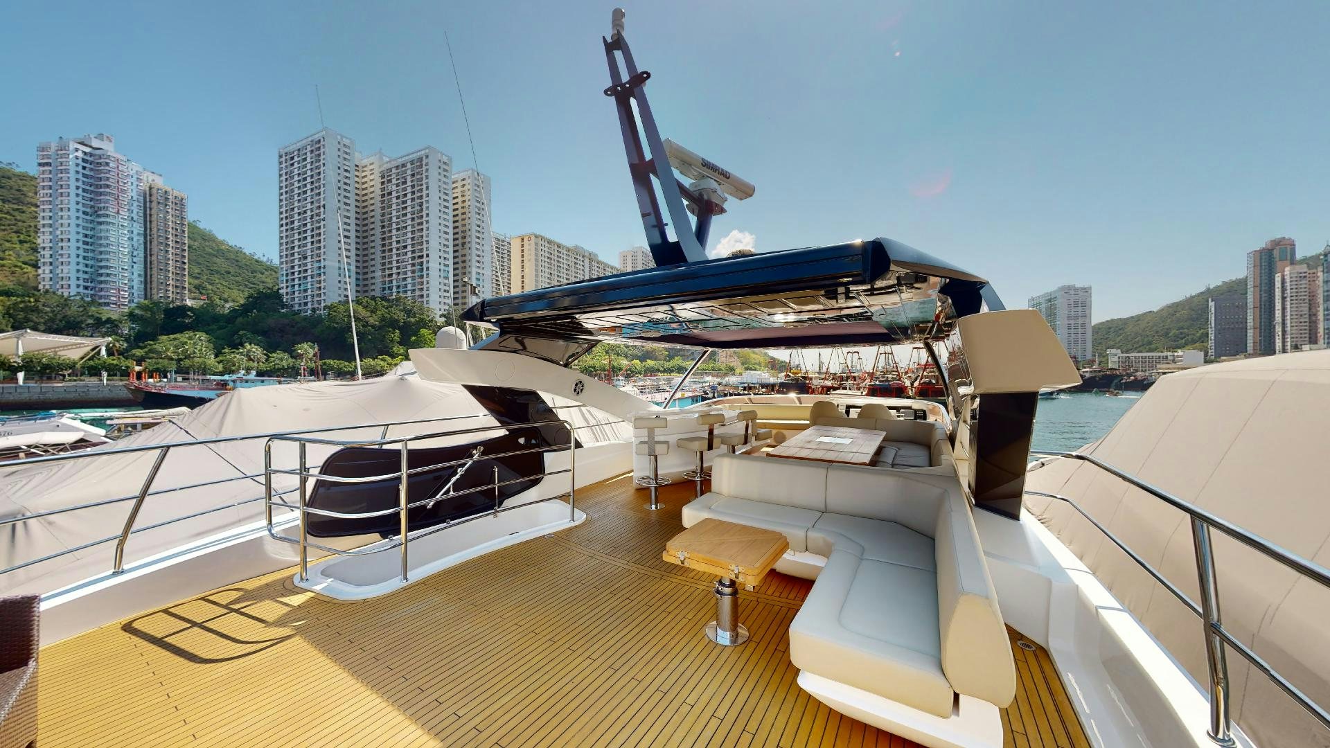 a deck with a large building and a body of water aboard A & K Yacht for Sale