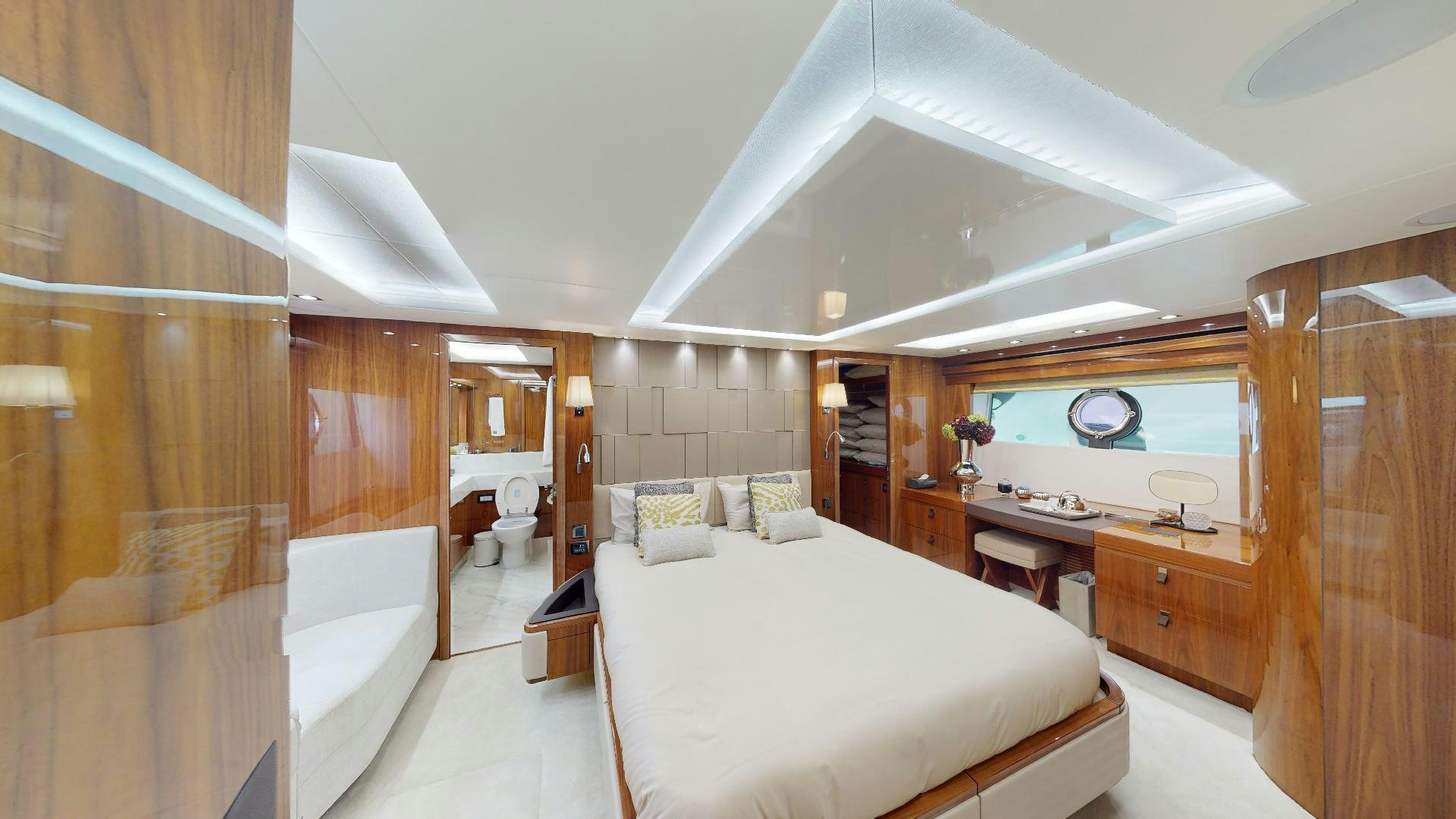 a large bedroom with a bed aboard A & K Yacht for Sale