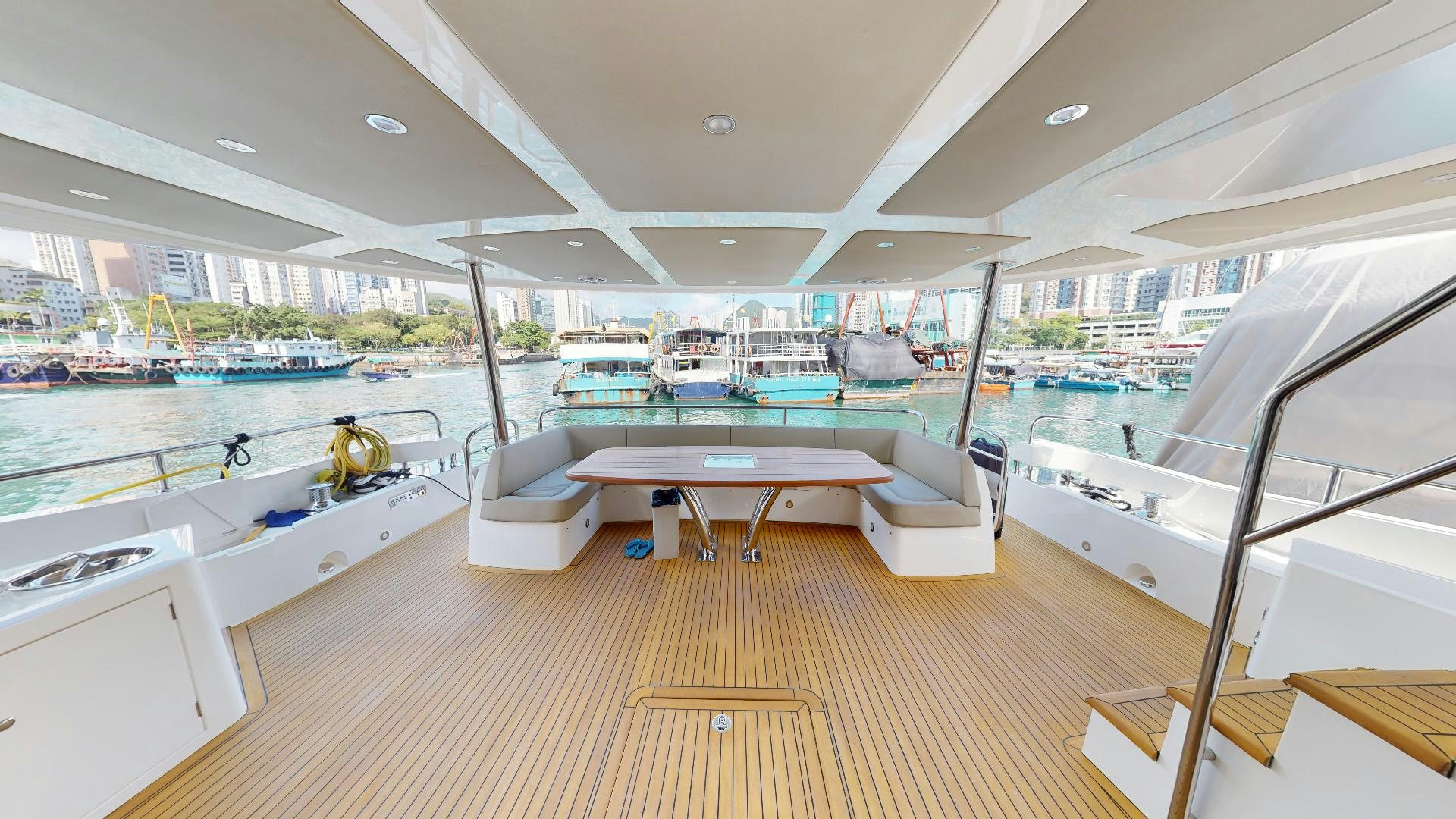 a room with a table and chairs aboard A & K Yacht for Sale
