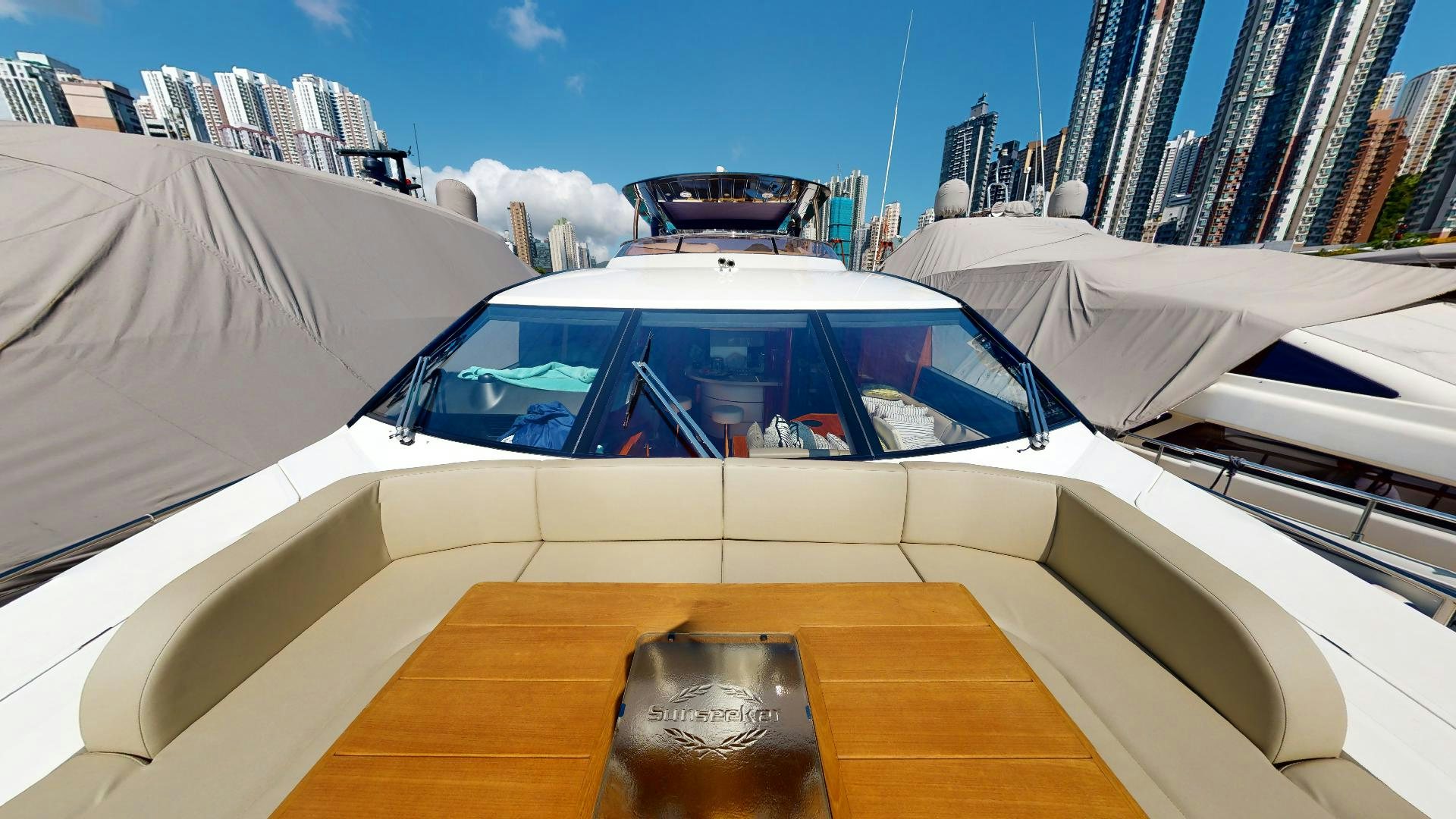 a white car with a large open door on a sunny day aboard A & K Yacht for Sale