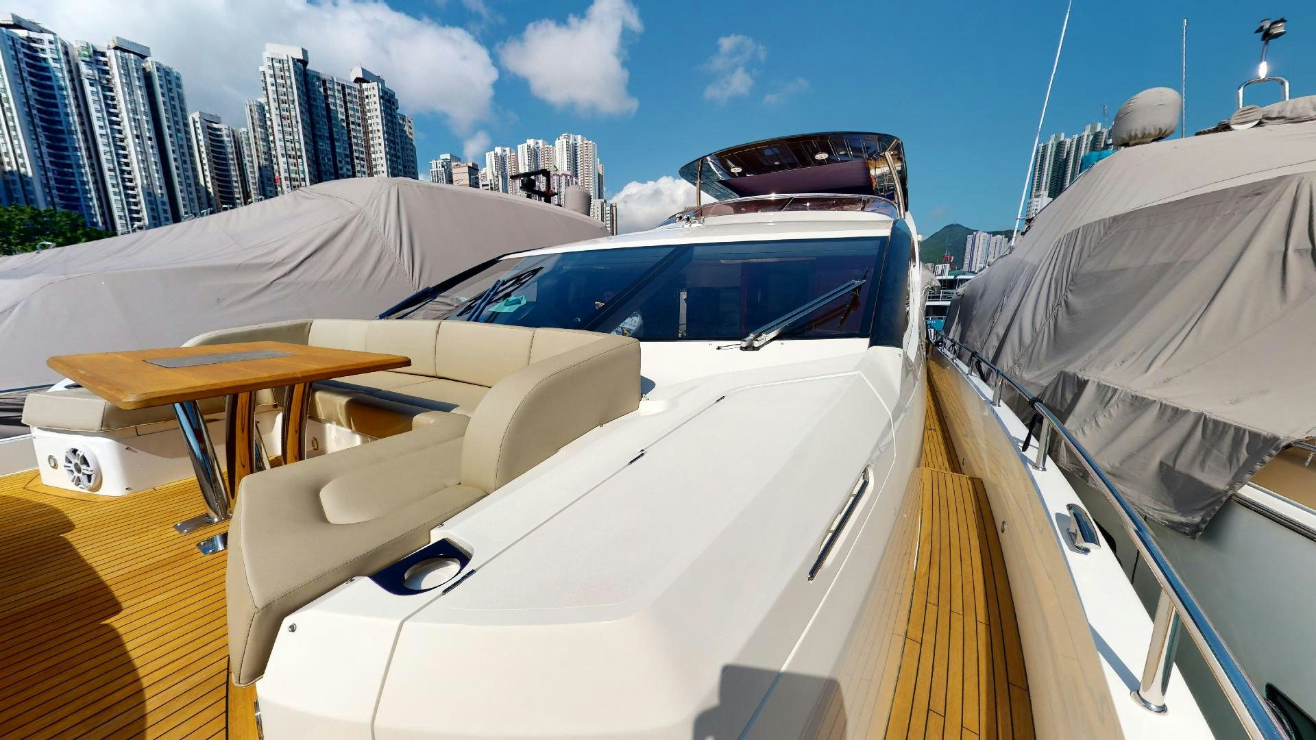a white car with a large windshield aboard A & K Yacht for Sale